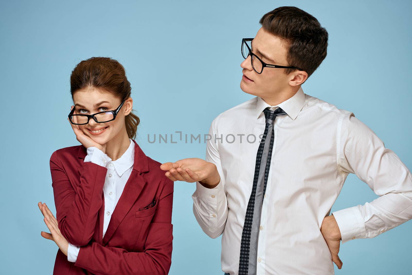 business man and woman office officials communication work colleagues studio blue background by SHOTPRIME