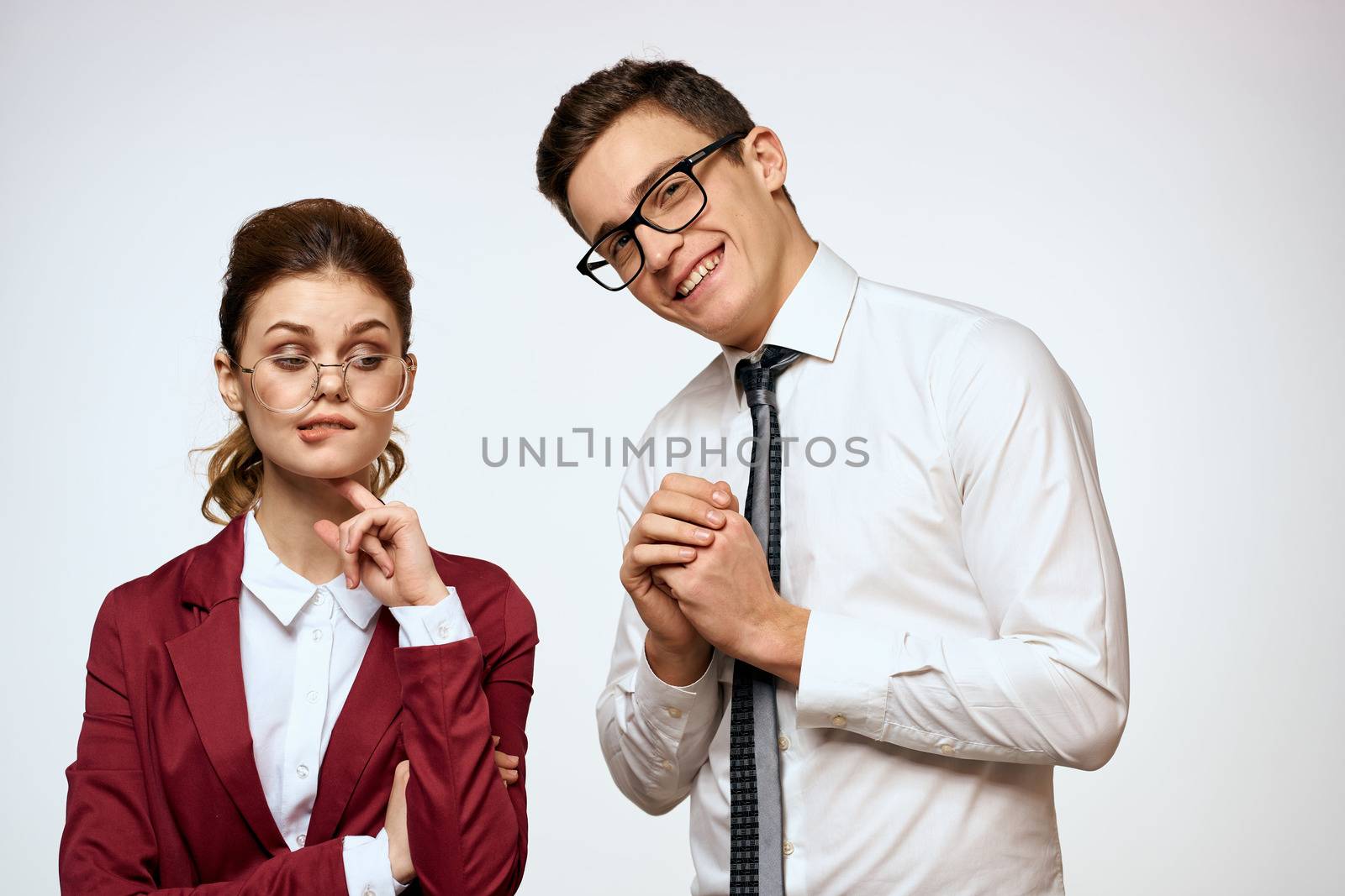 man and woman work colleagues officials communication light background by SHOTPRIME