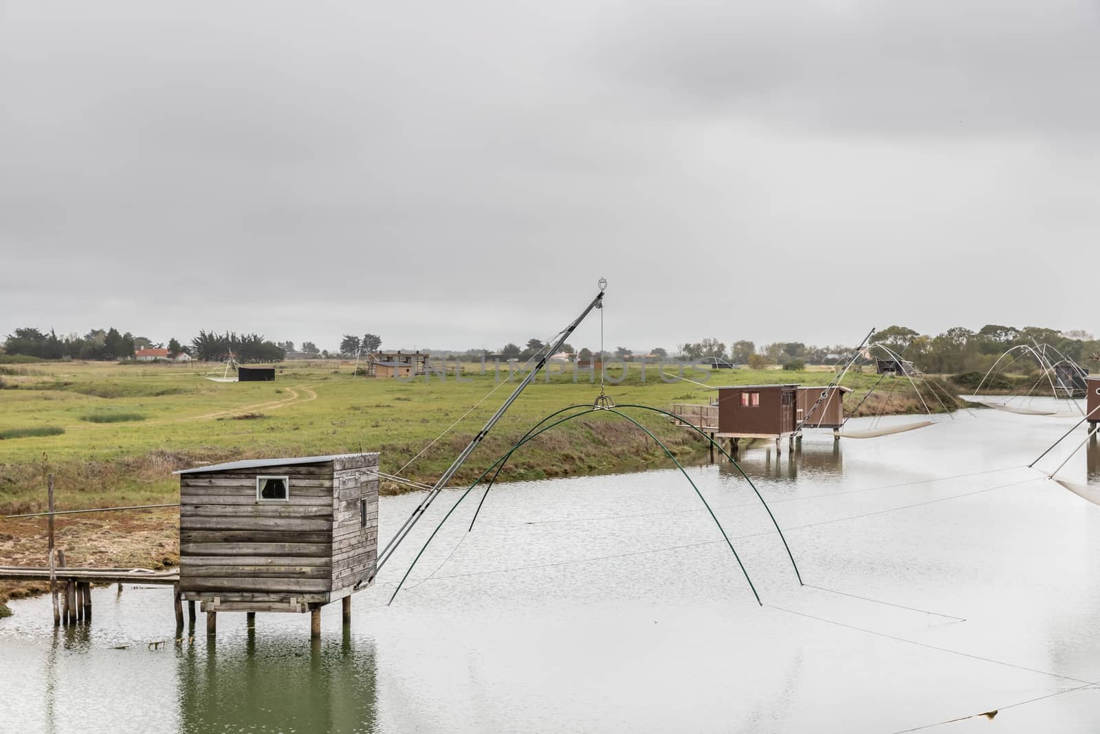 Carrelet de Pêche, the emblematic fisherman's hut of the coastal landscapes of Vendee, Charente-Maritime, in the estuary of La Gironde, La Charente, La Loire or in the Marais Poitevin