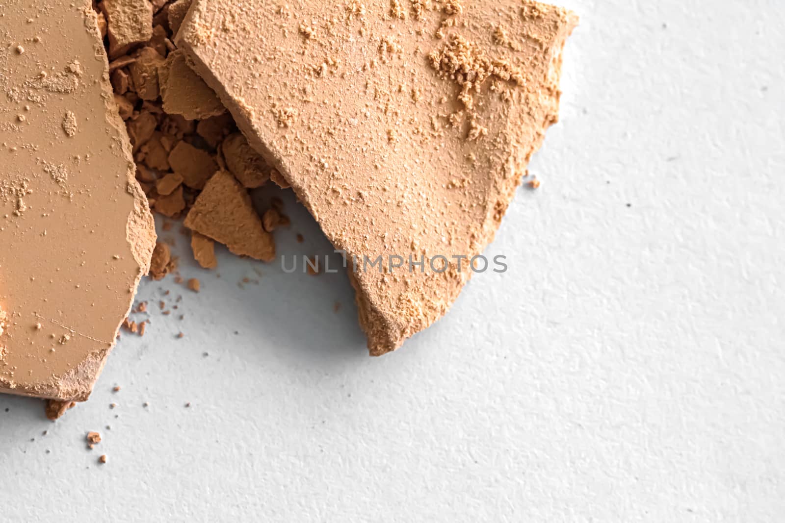 Beige eye shadow powder as makeup palette closeup isolated on white background, crushed cosmetics and beauty texture by Anneleven