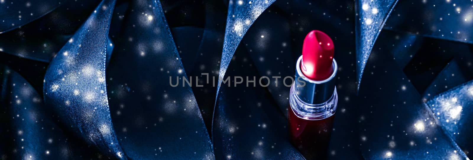 Red lipstick on blue silk and shiny glitter background, luxury make-up and beauty cosmetic by Anneleven