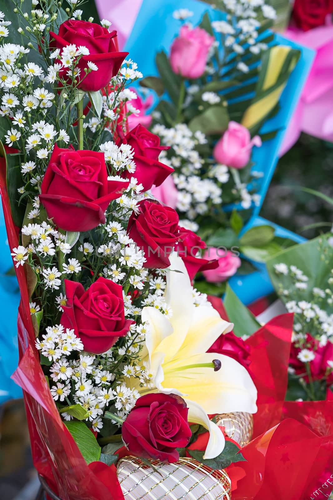 Beautiful bouquet made of roses and other flowers in various colors