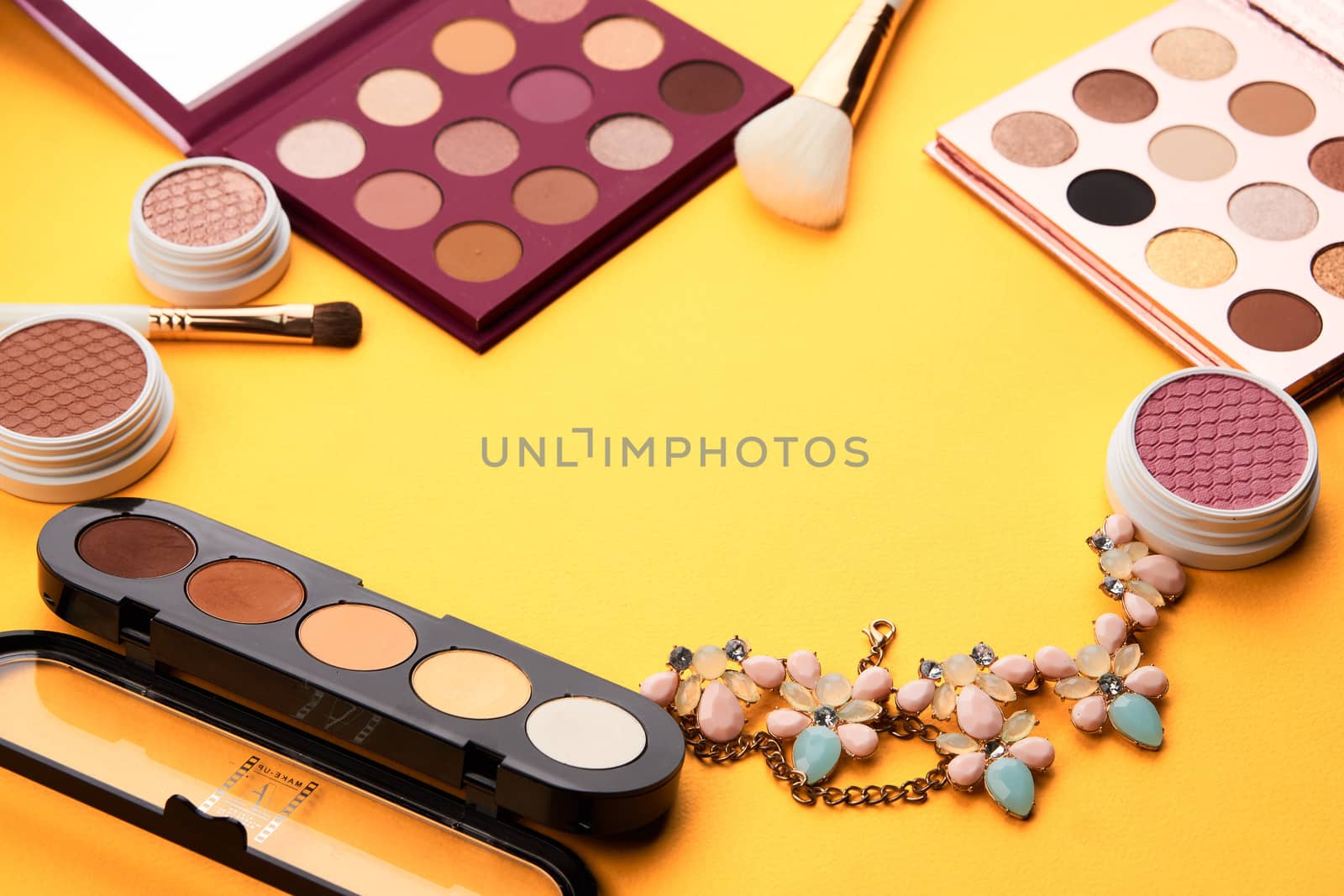 Professional cosmetics palette with eyeshadow makeup brushes cropped look. High quality photo