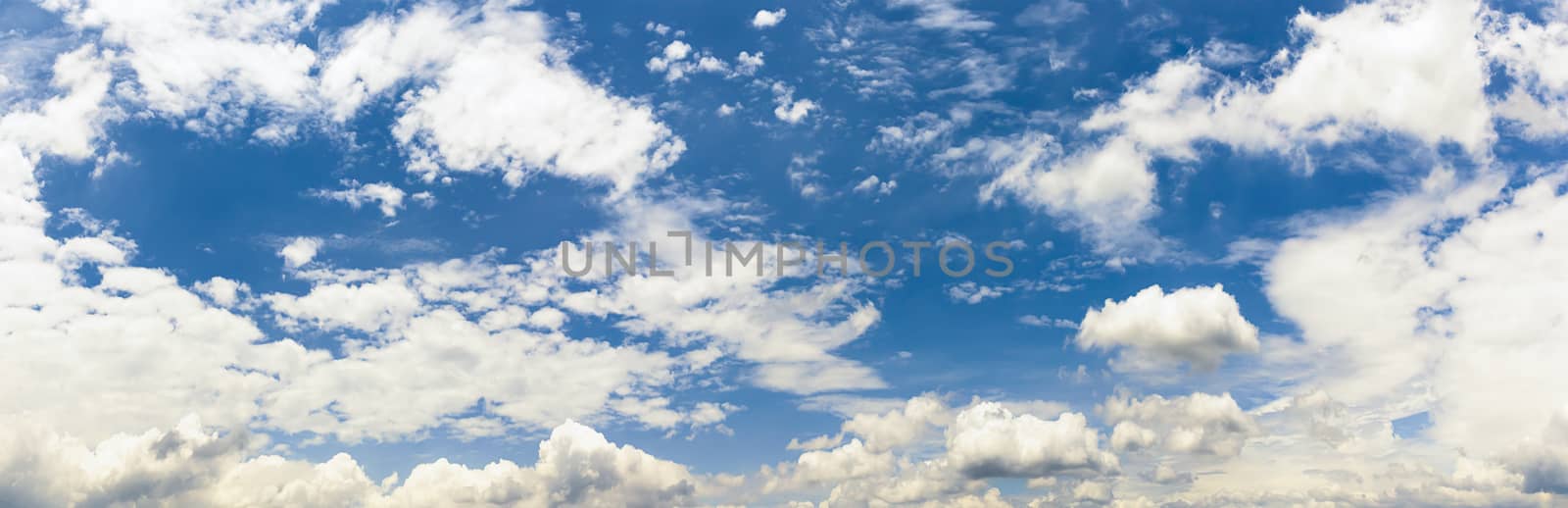 Panoramic white fluffy clouds in the blue sky, Fantastic soft white clouds against blue sky