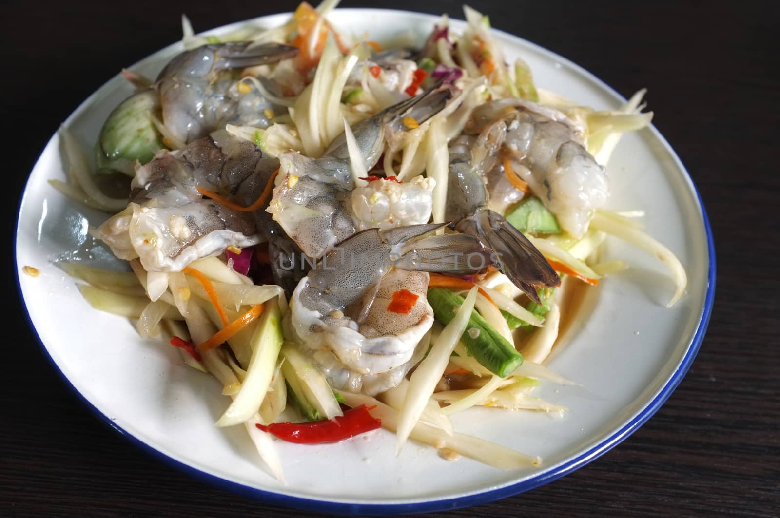 Thai green papaya salad with raw shrimps or Som Tam Thai Gung