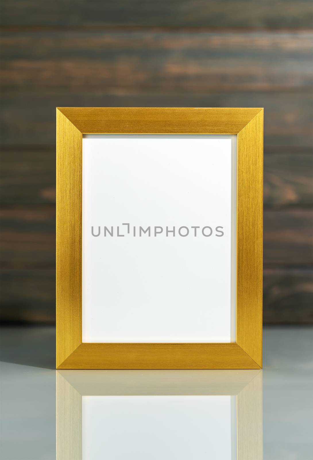 Picture golden frame mock up and Artificial flower vase bouquet over table with wood wall background