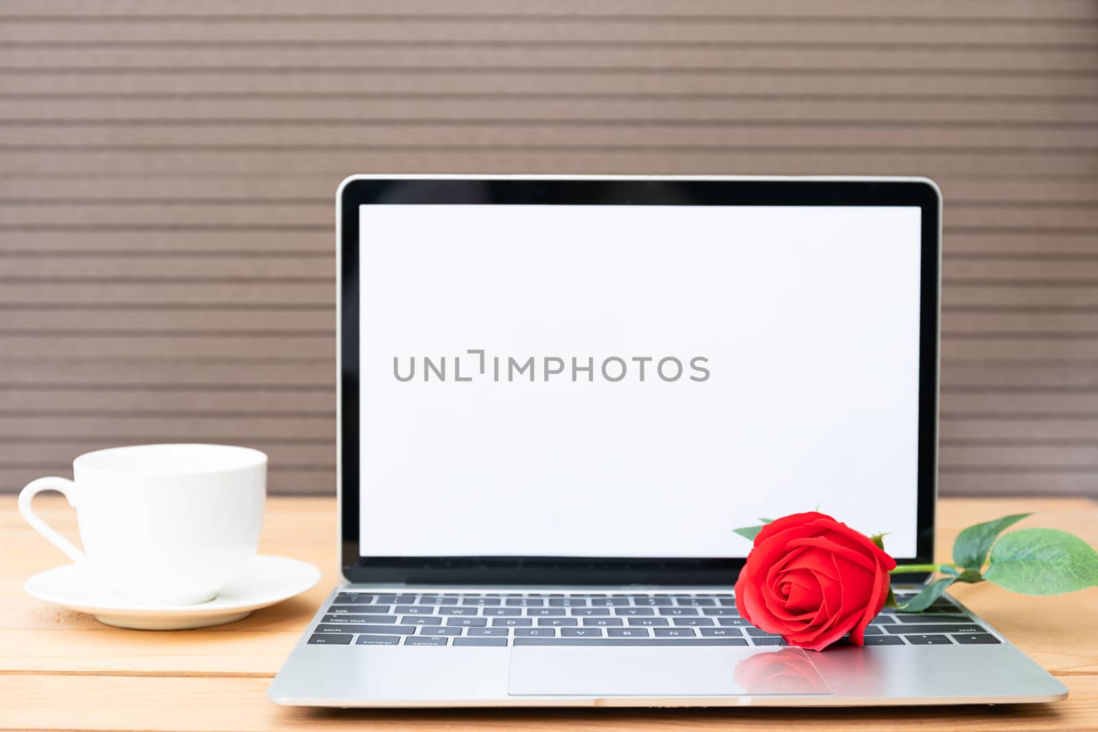 Red rose and coffee cup with laptop mockup on wood  by stoonn