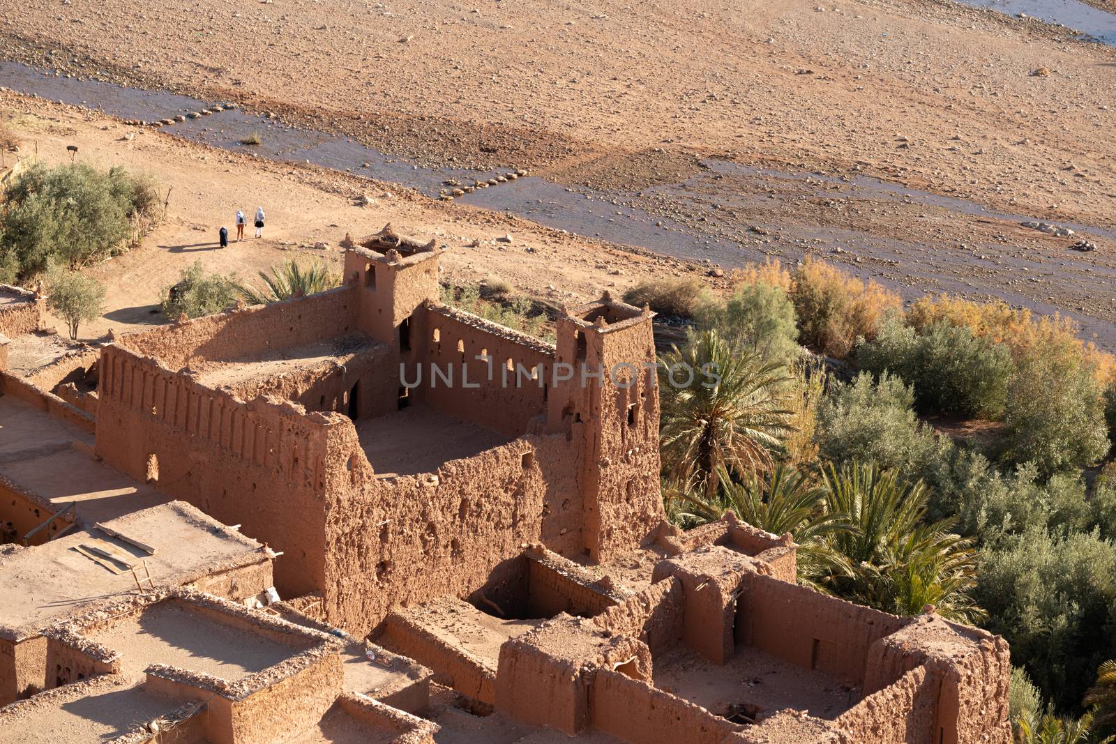 Ait Ben Haddou ksar Morocco, ancient fortress that is a Unesco Heritage site. Beautiful late afternoon light with honey, gold coloured mud brick construction the kasbah, or fortified town dates from 11th cent. and is on the former caravan route from the Sahara and Marrakech. The location has been used for many famous movies. High quality photo