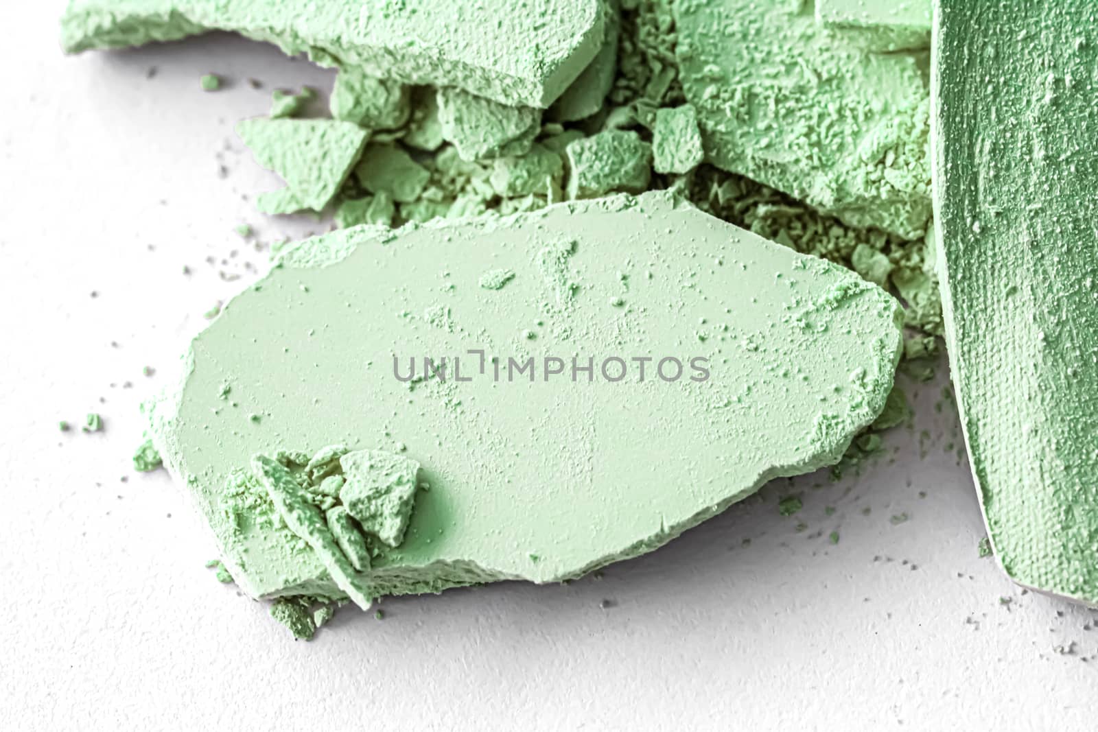 Green eye shadow powder as makeup palette closeup isolated on white background, crushed cosmetics and beauty texture by Anneleven