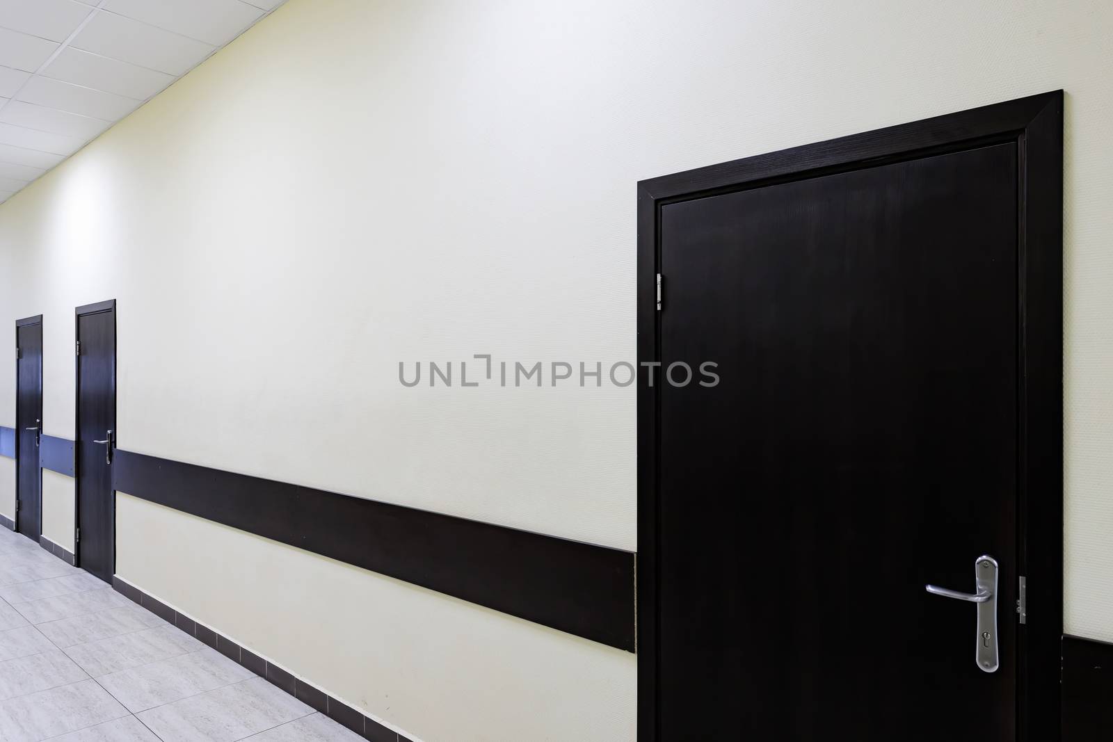 empty corridor in the modern office building by bonilook