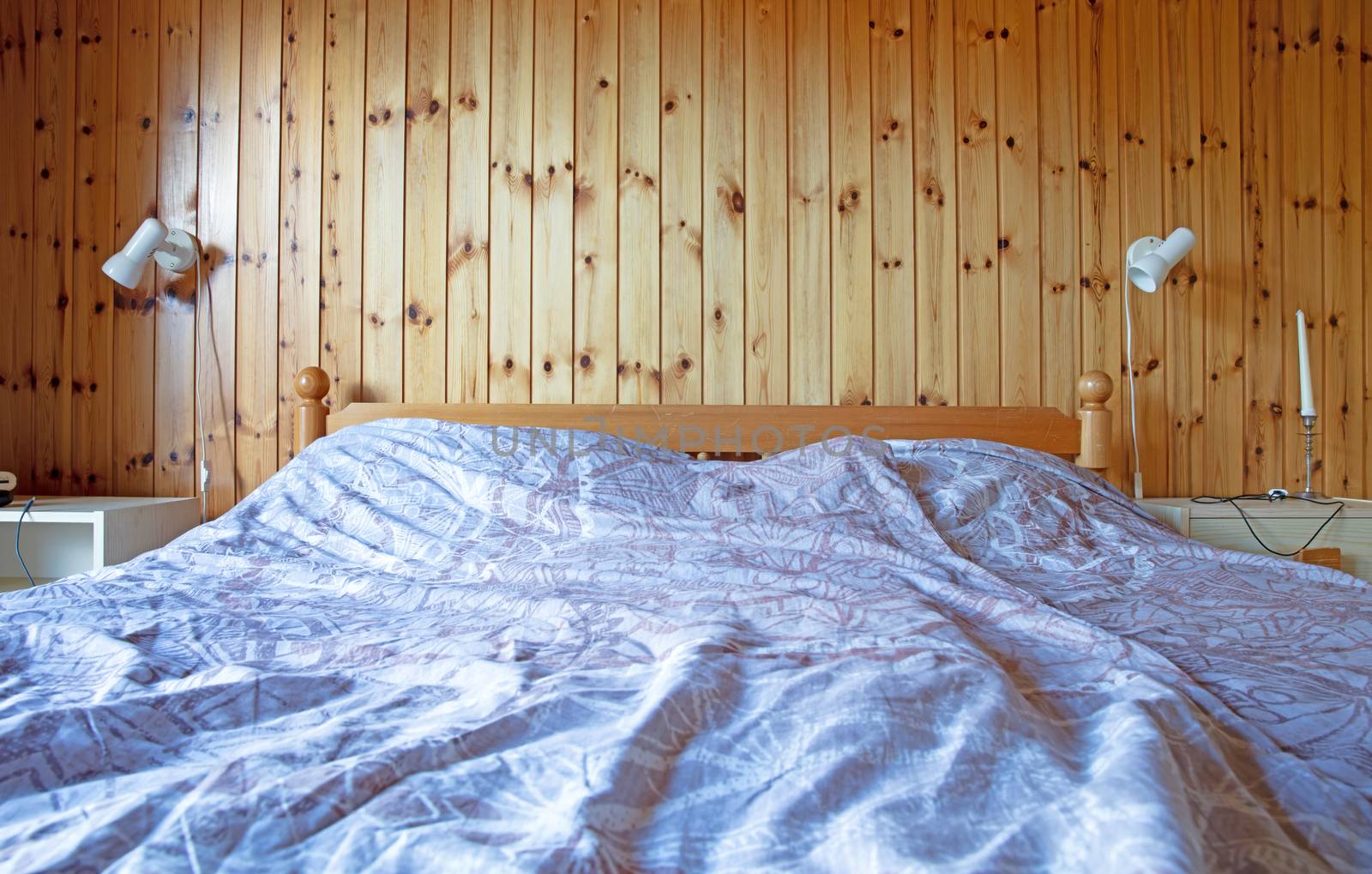 Old bedroom with queen double bed, wooden wall