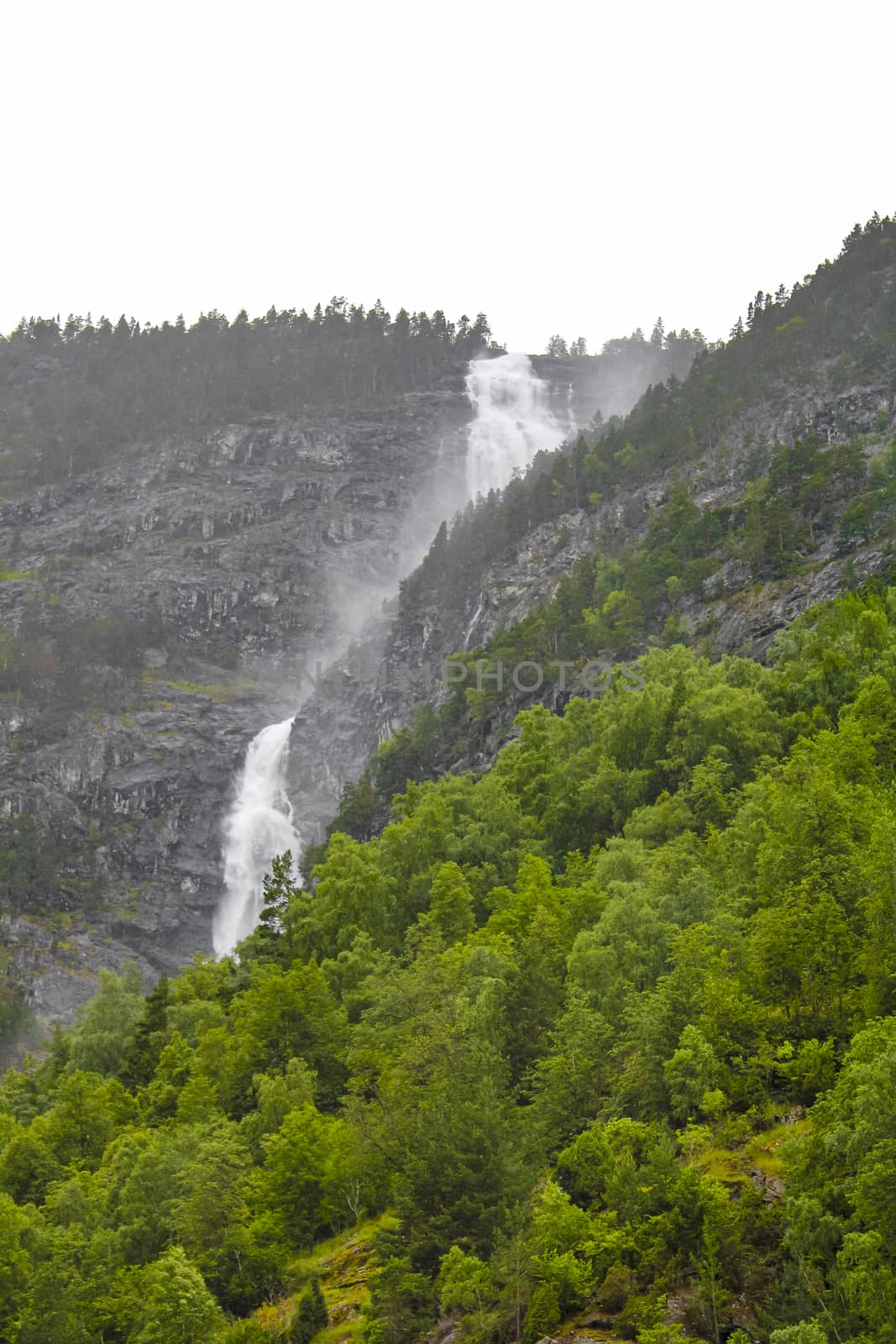 Waterfall in Aurlandsfjord Aurland Sognefjord in Norway. by Arkadij