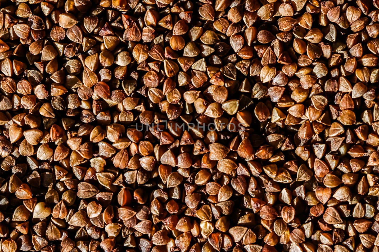 Buckwheat grain closeup, food texture and cook book background by Anneleven