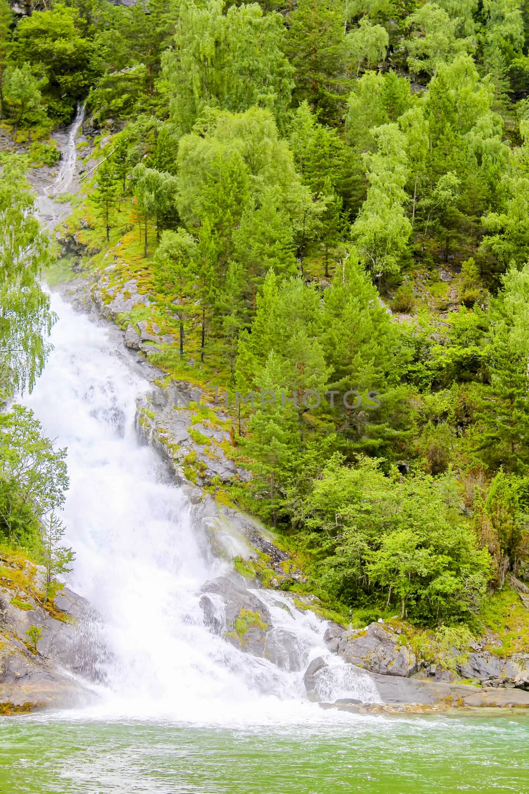 Waterfall in Aurlandsfjord Aurland Sognefjord in Norway. by Arkadij