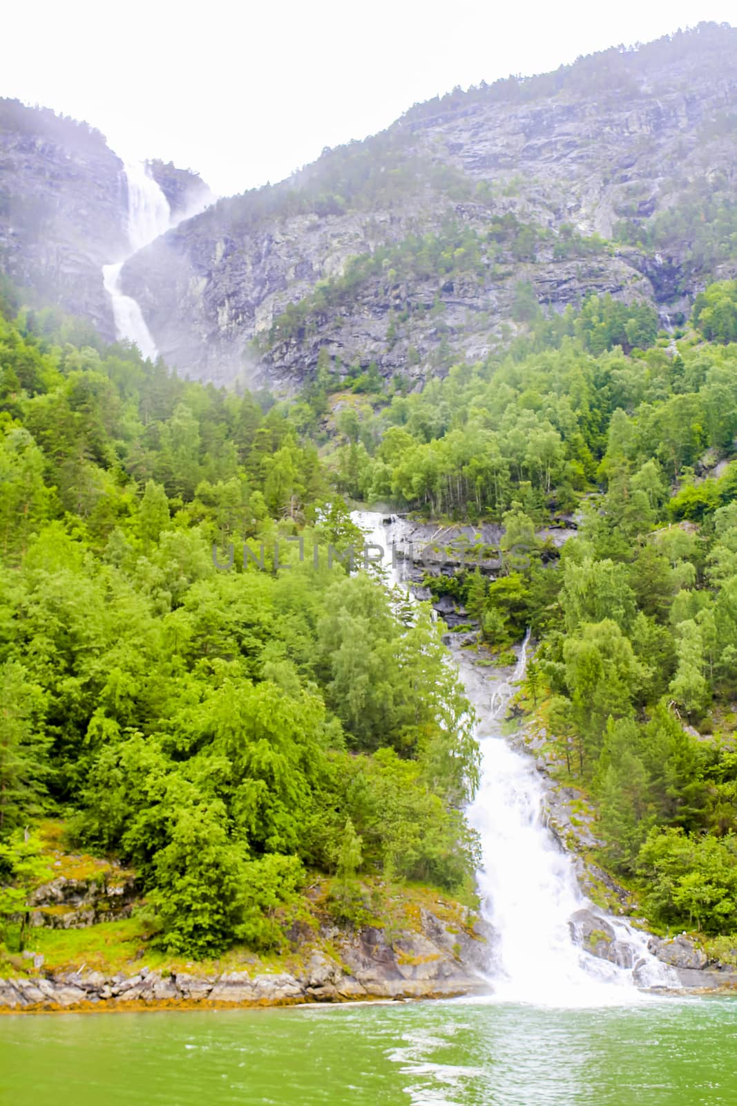 Waterfall in Aurlandsfjord Aurland Sognefjord in Norway. by Arkadij