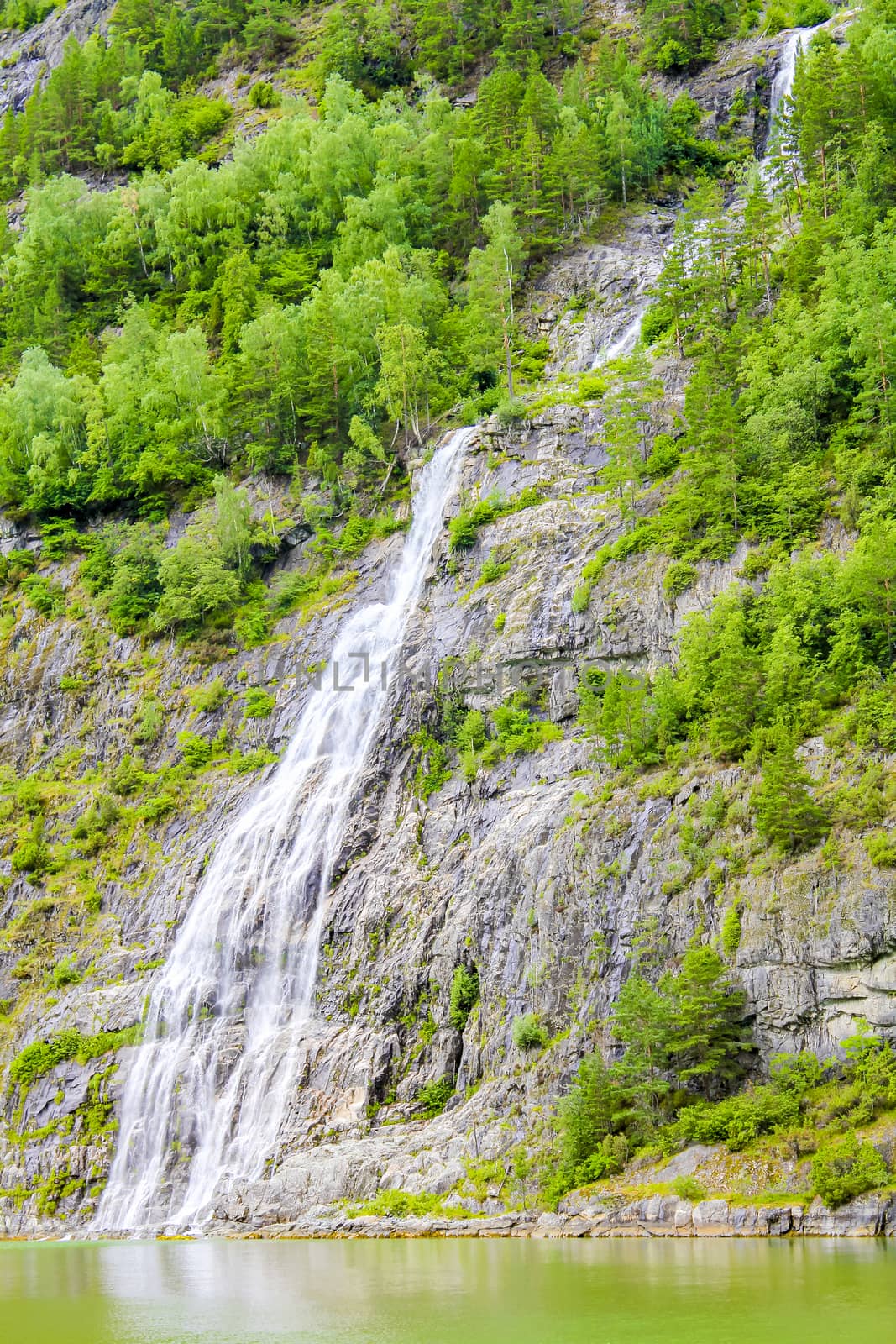 Waterfall in Aurlandsfjord Aurland Sognefjord in Norway. by Arkadij