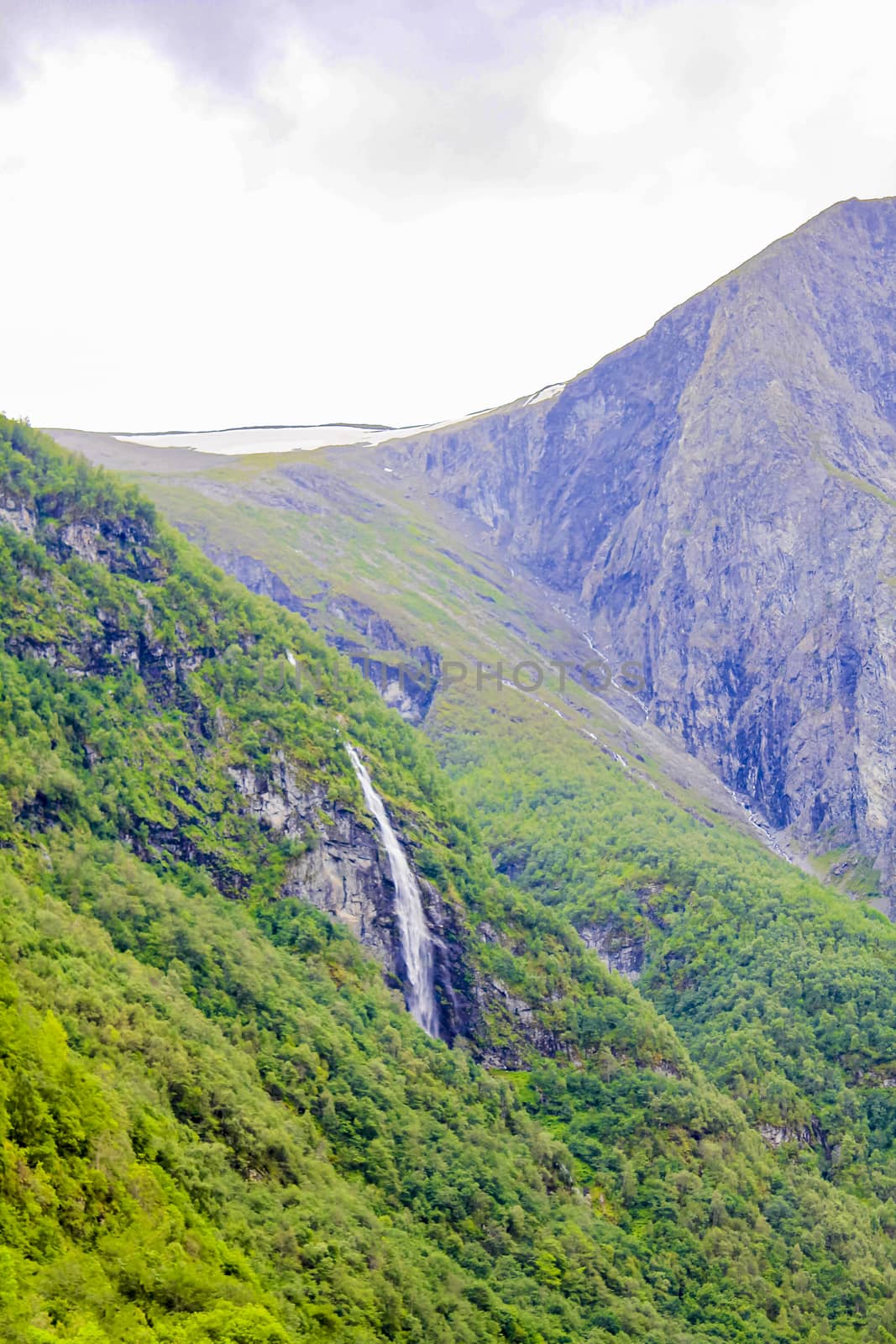 Waterfall and snow Aurlandsfjord Aurland Sognefjord in Norway. by Arkadij