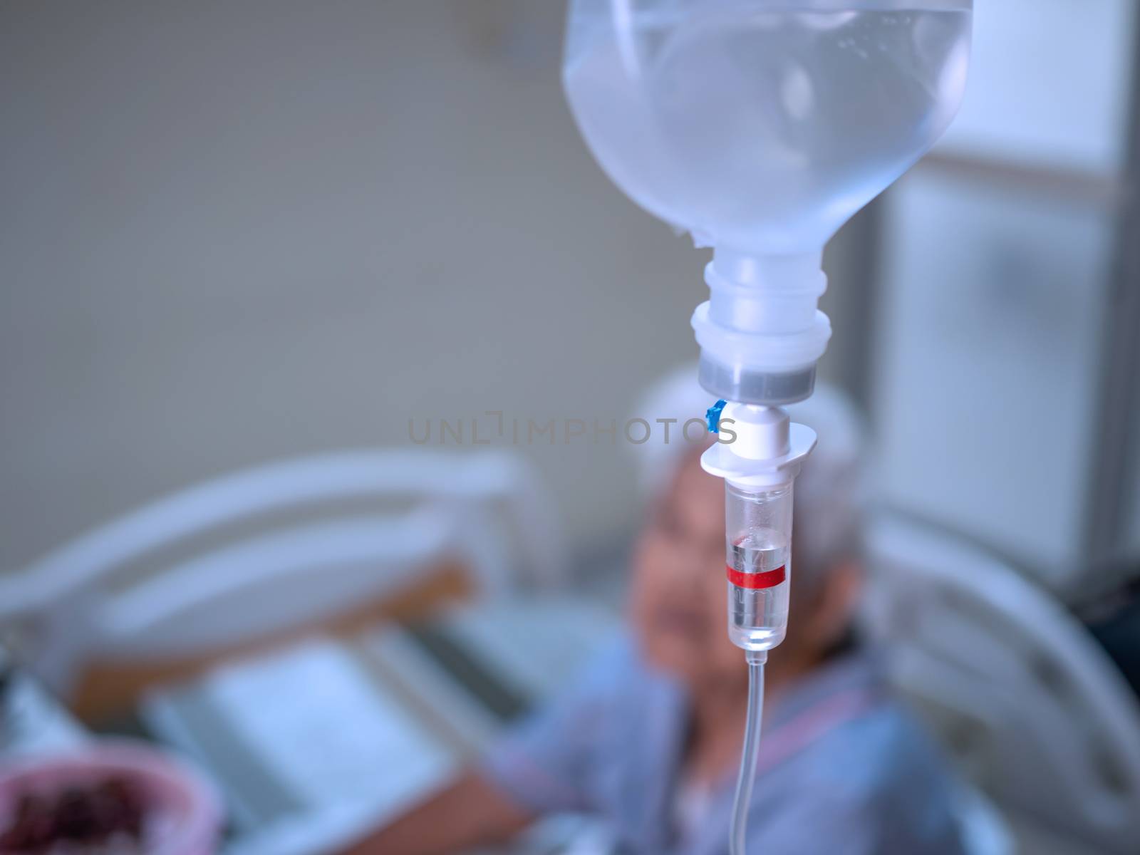 Close up saline solution drip for patient in hospital. Health and medical equipment.