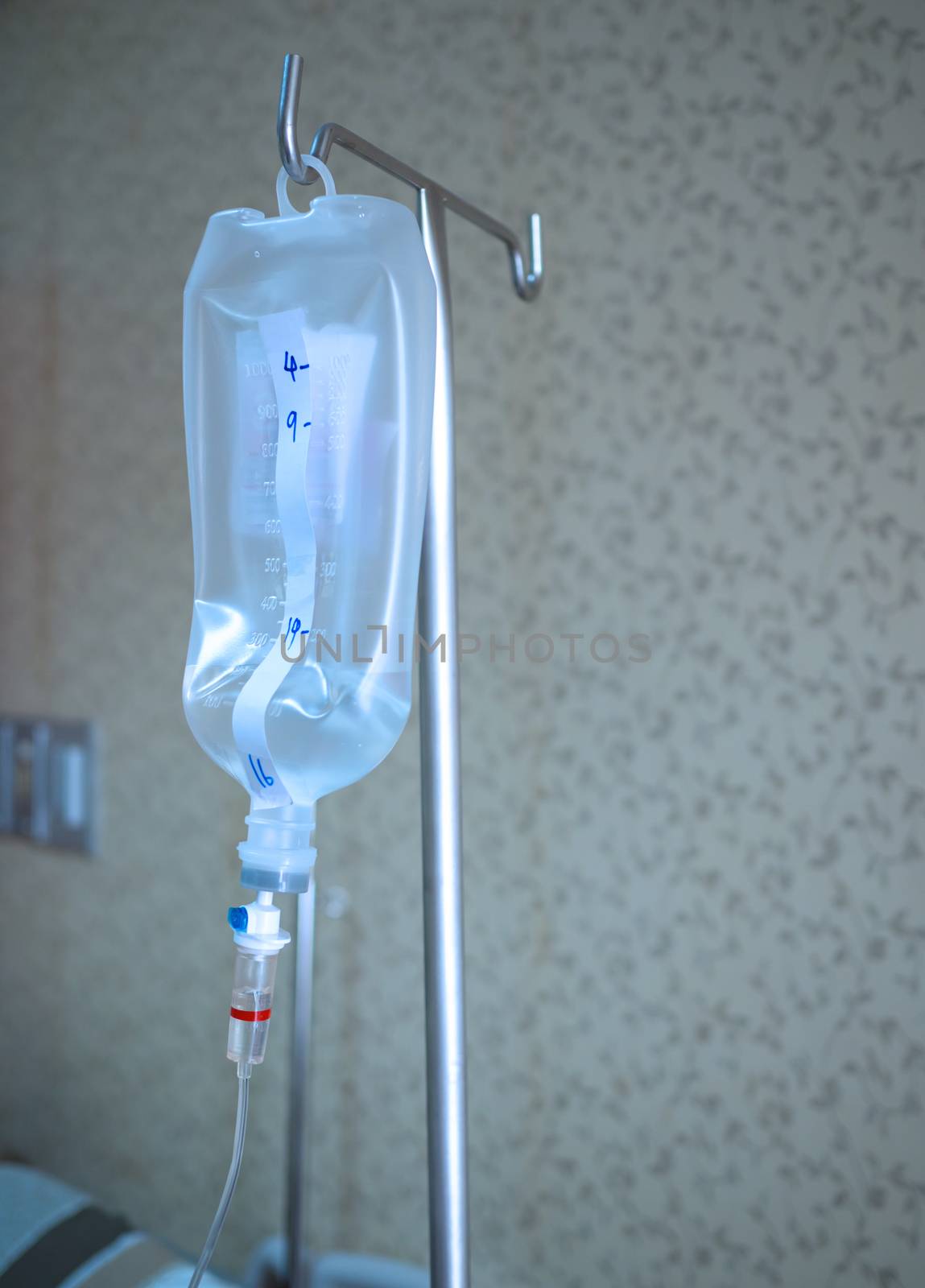 Saline jar hanging in a steel pole in the hospital. Health and medical equipment concept.