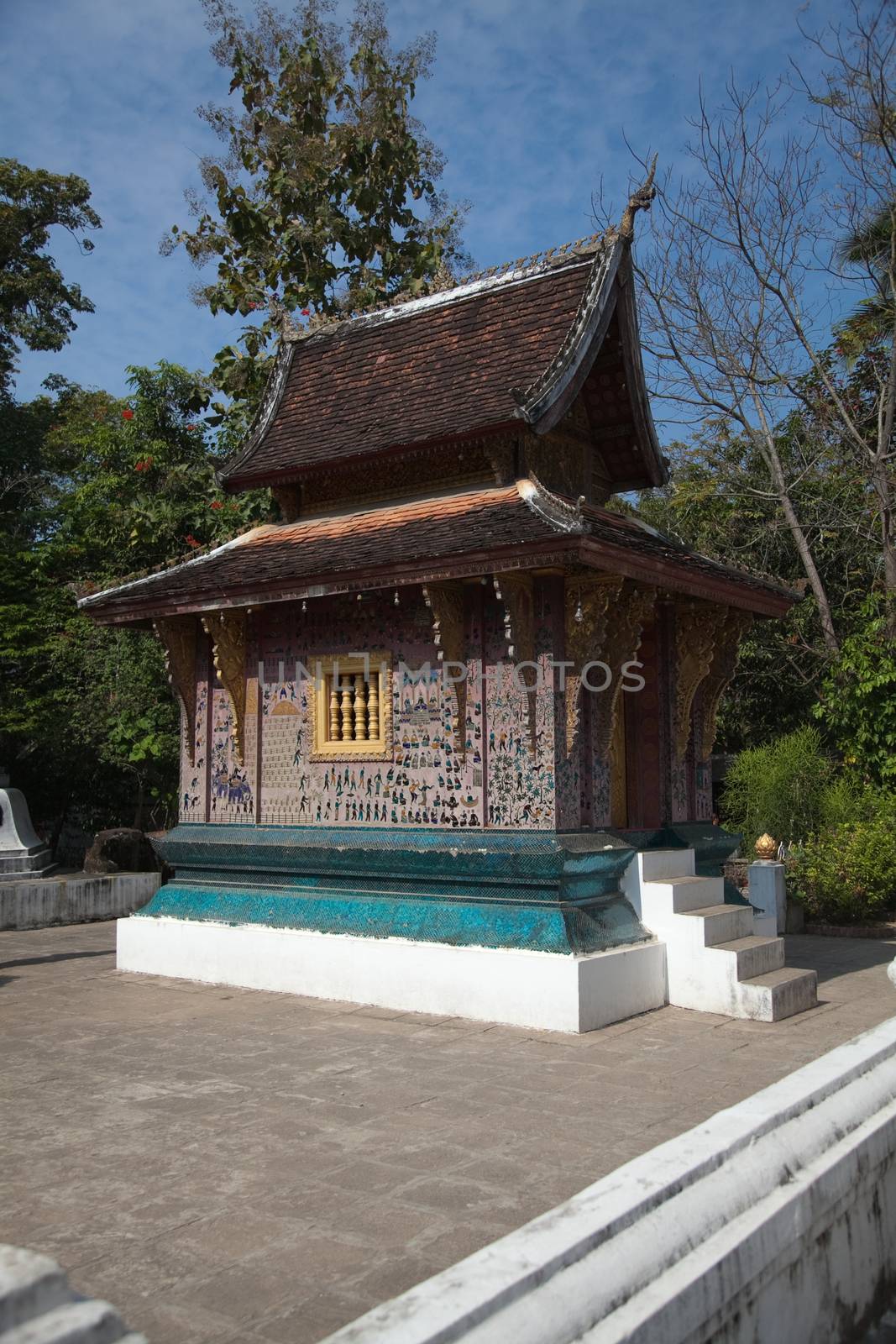 Temples at Luang Prabang Laos with Buddha statues and detailed golden shrines by kgboxford