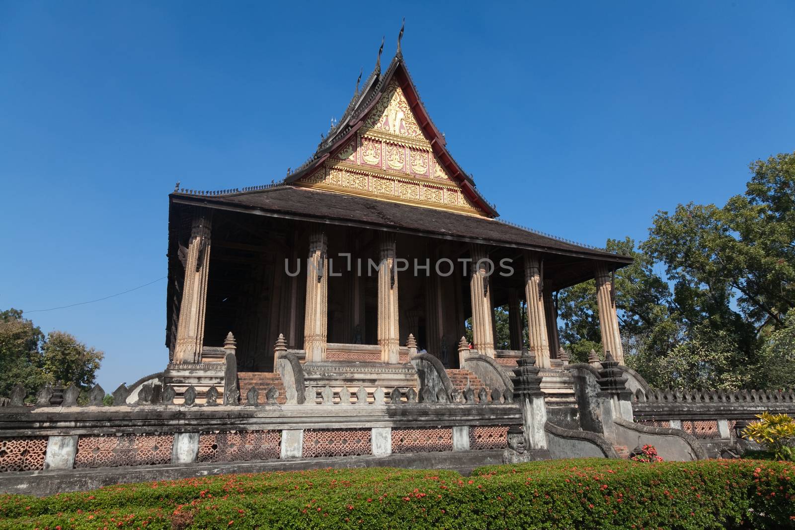 Temples at Luang Prabang Laos with Buddha statues and detailed golden shrines. High quality photo