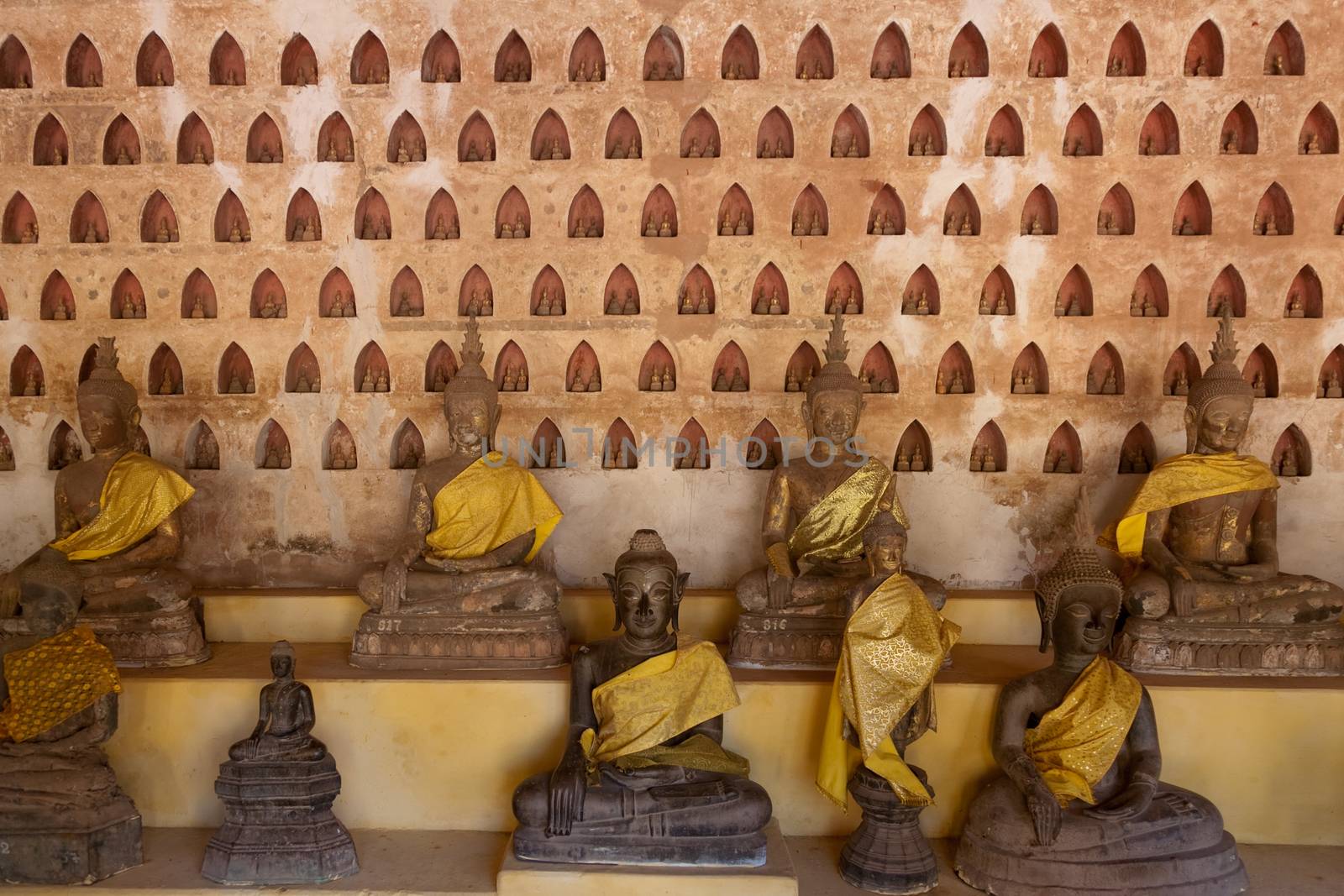 Temples at Luang Prabang Laos with Buddha statues and detailed golden shrines by kgboxford