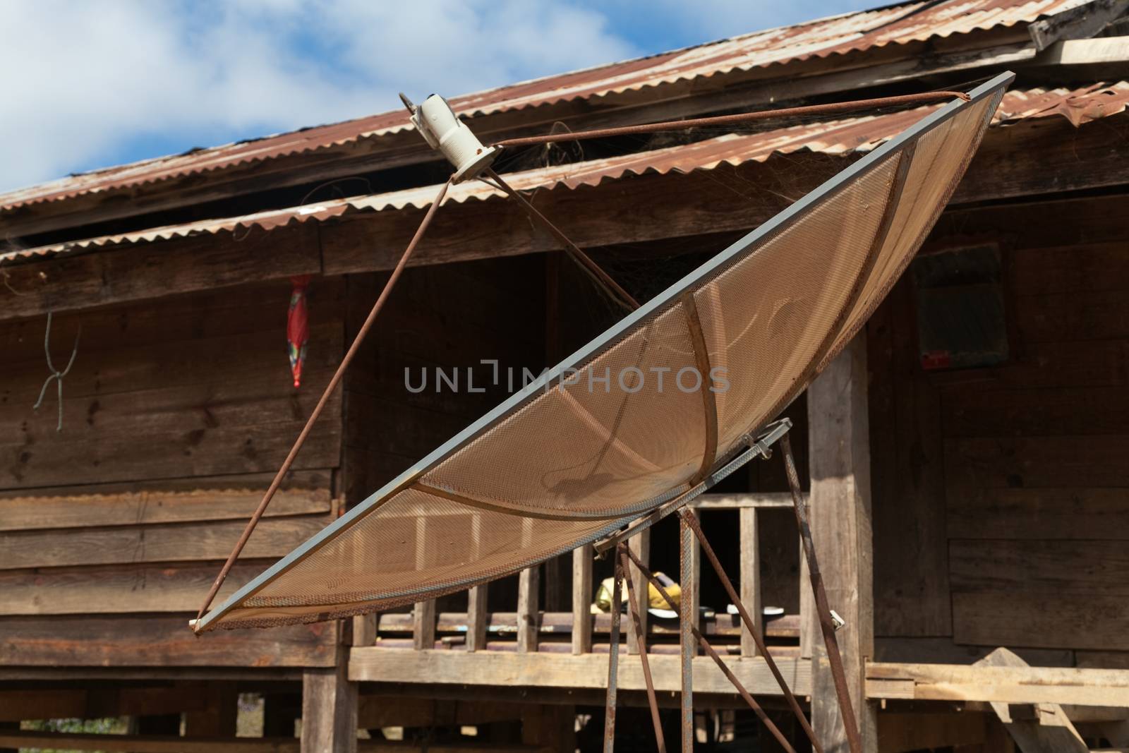 Ban Napia near Phonsavan Laos village houses where people make spoons from bombs leftover from Vietnam war and use empty bomb casings . High quality photo