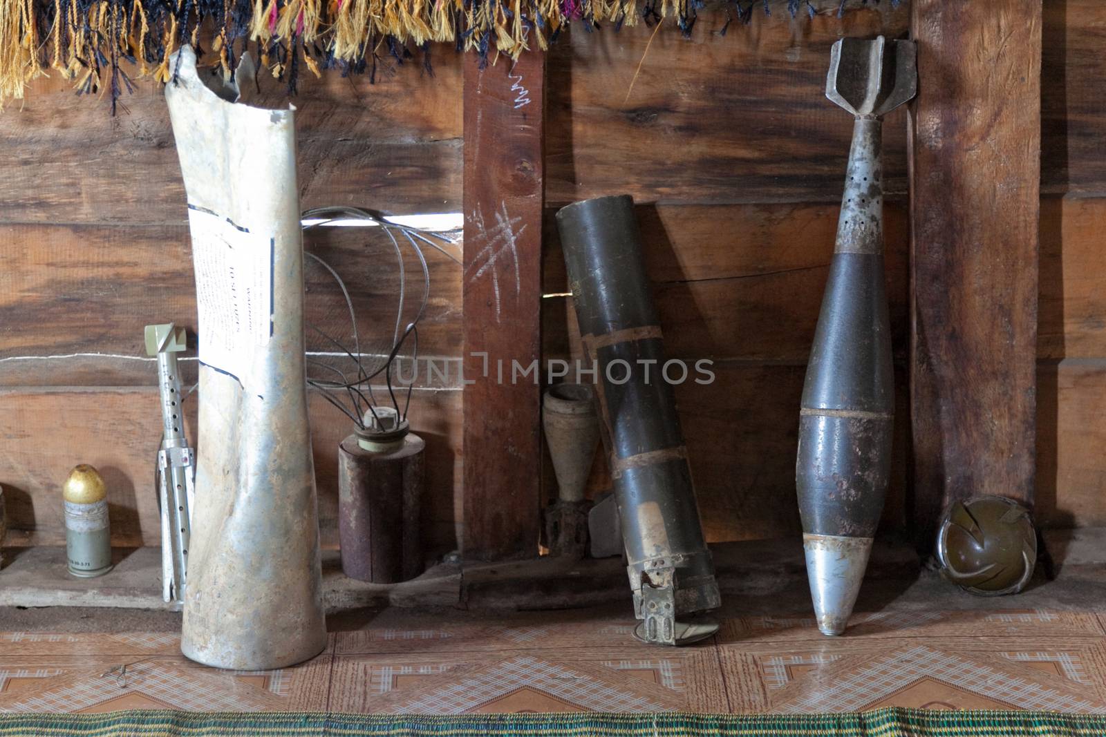 Ban Napia near Phonsavan Laos a village where people makes spoons from bombs leftover from Vietnam war. Display in house of collection of shell casings and local made fabricsHigh quality photo