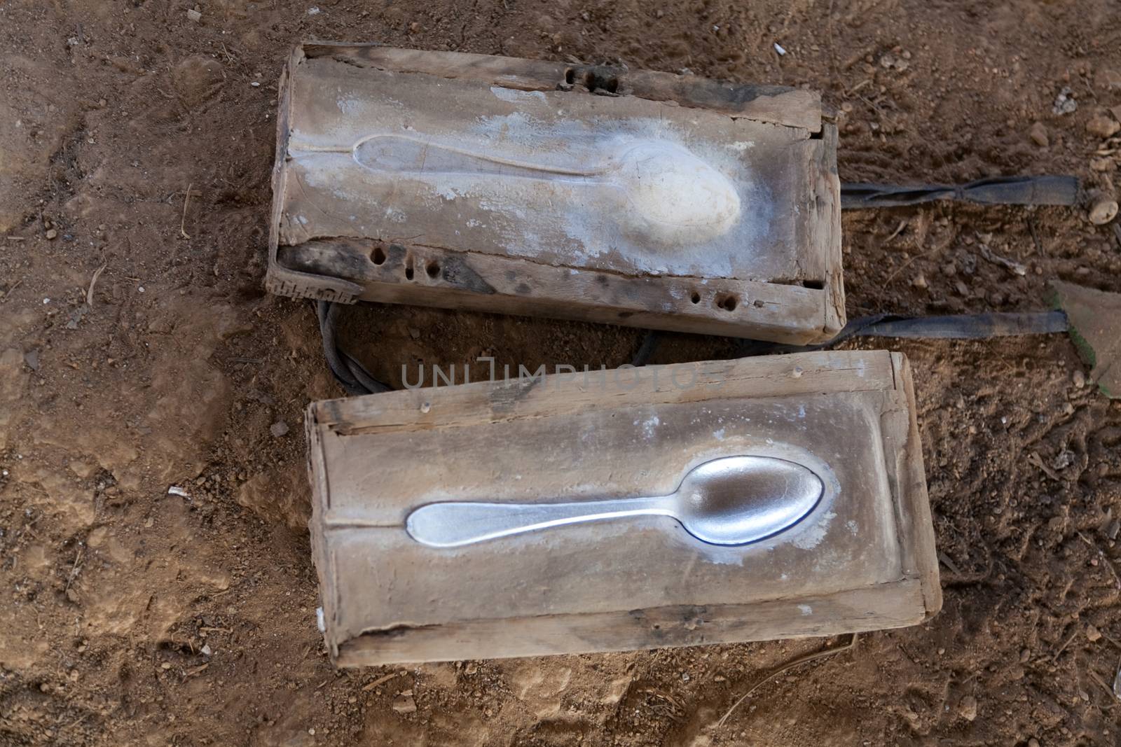 Ban Napia near Phonsavan Laos a village where people makes spoons from bombs leftover from Vietnam war. Examples of moulds used to make spoons from molten aluminium.High quality photo