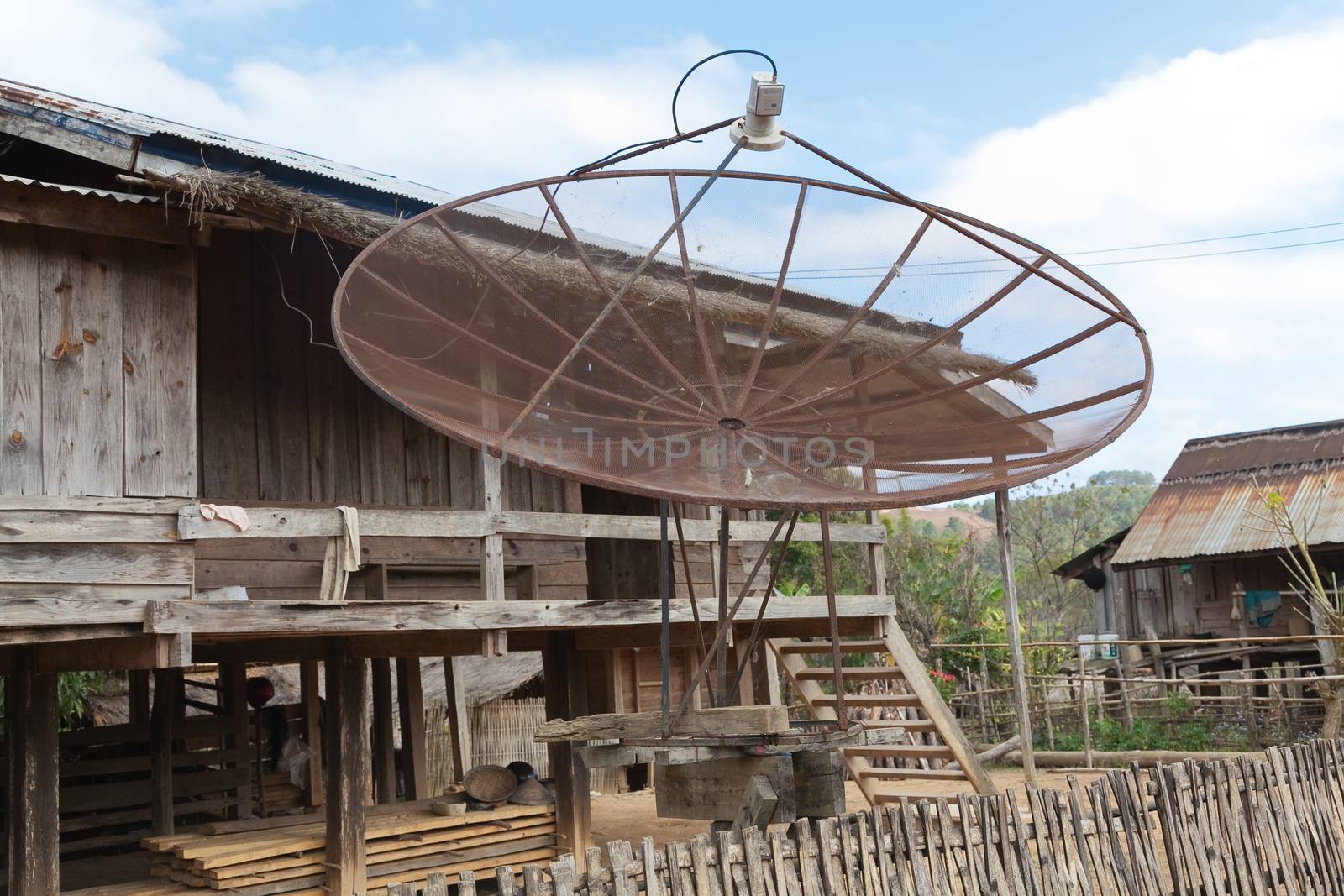 Ban Napia near Phonsavan Laos village houses where people make spoons from bombs leftover from Vietnam war and use empty bomb casings . High quality photo