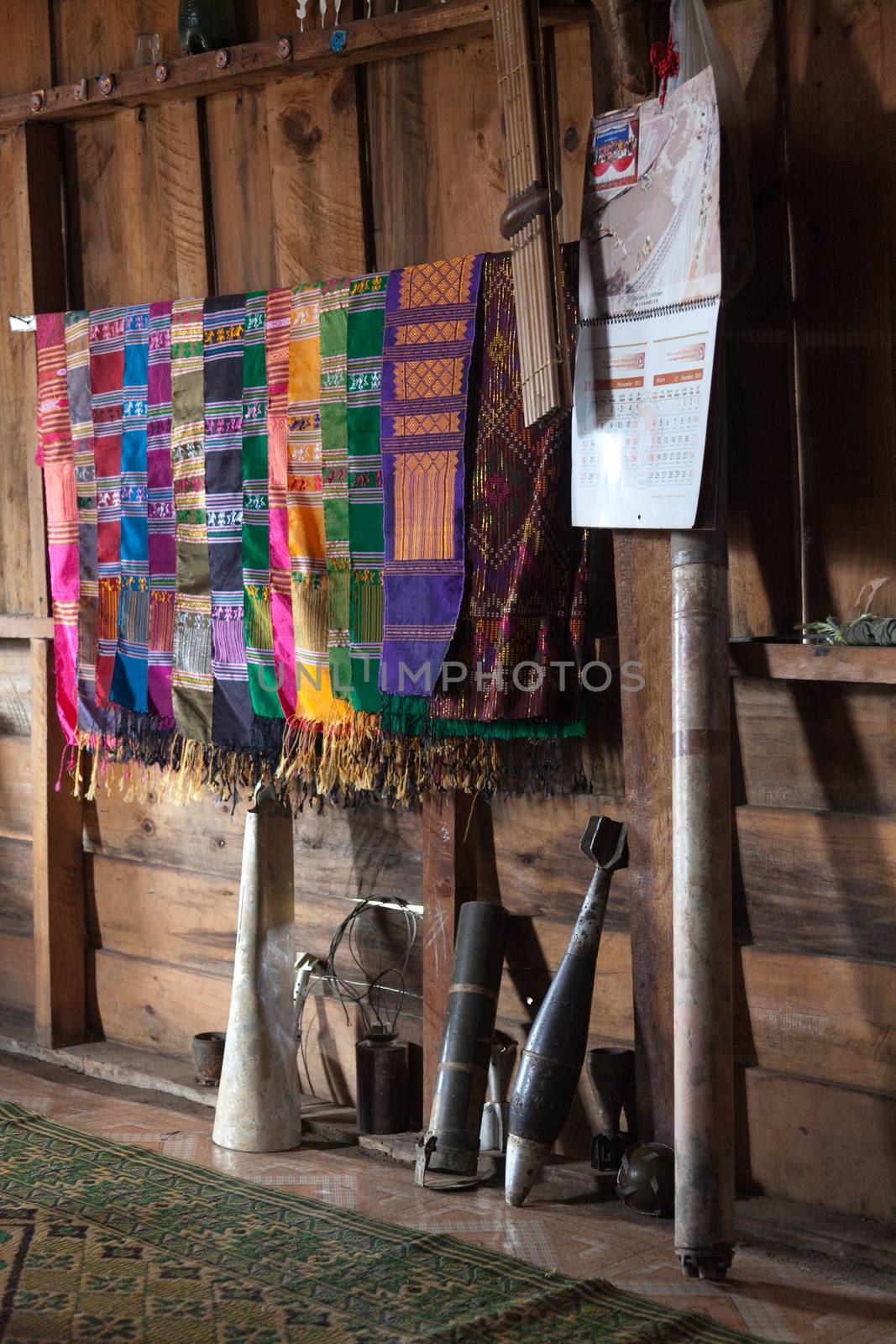 Ban Napia Laos house interior display of bombs leftover from Vietnam war by kgboxford