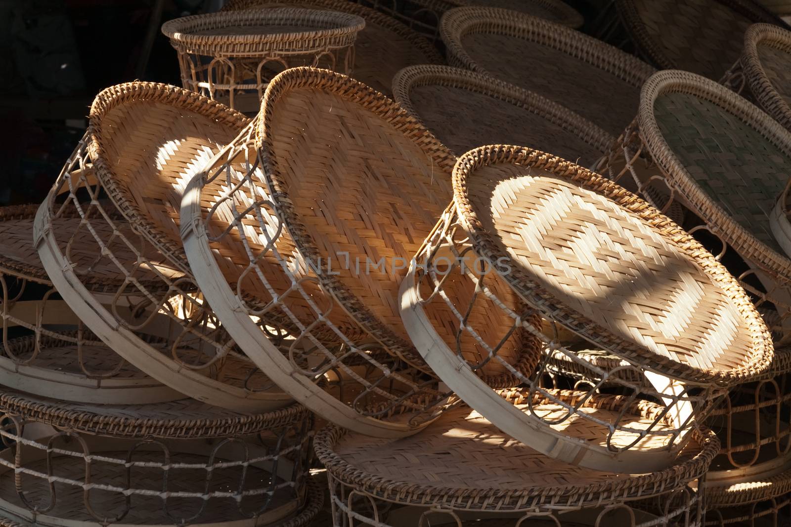 Laos, wicker woven reed baskets and containers in market, patterned weaving by kgboxford