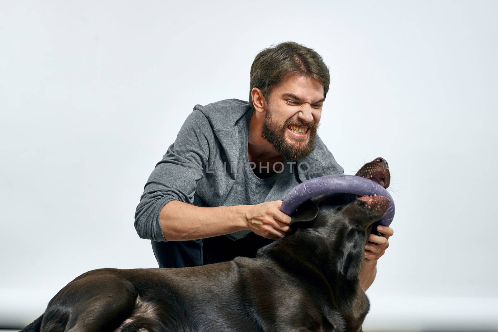 happy owner with pet black dog training model emotions by SHOTPRIME