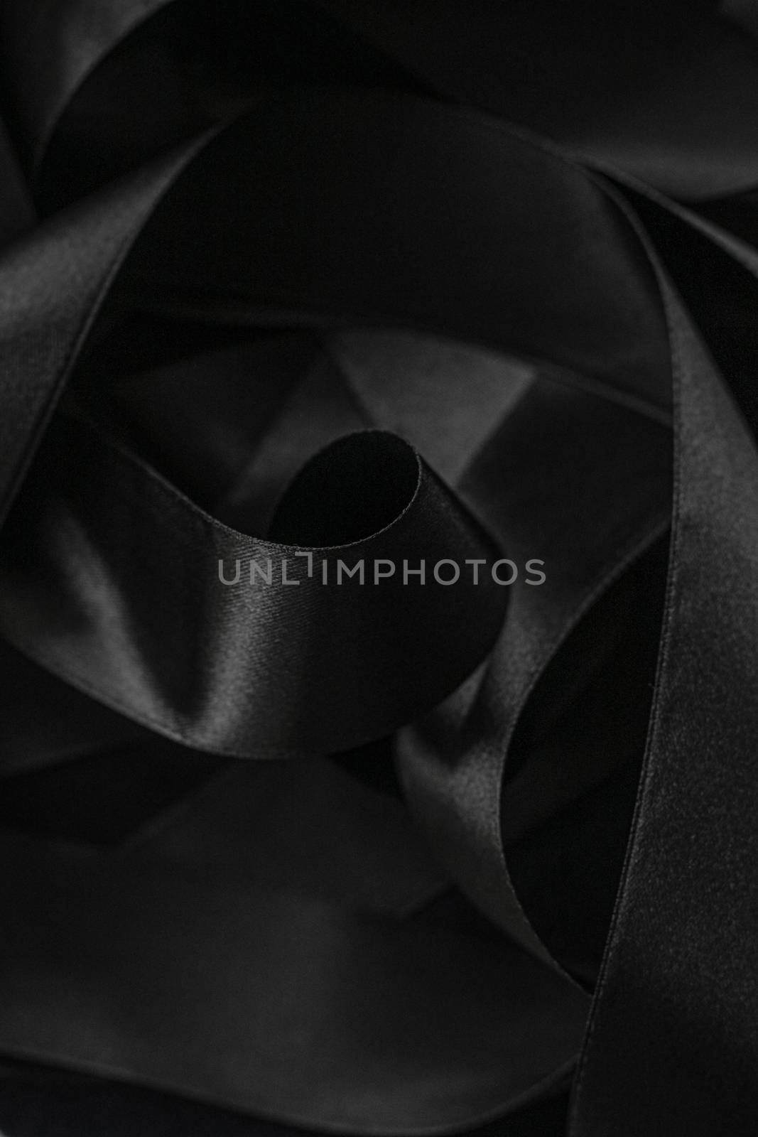 Black silk ribbon as background, abstract and luxury brand design by Anneleven