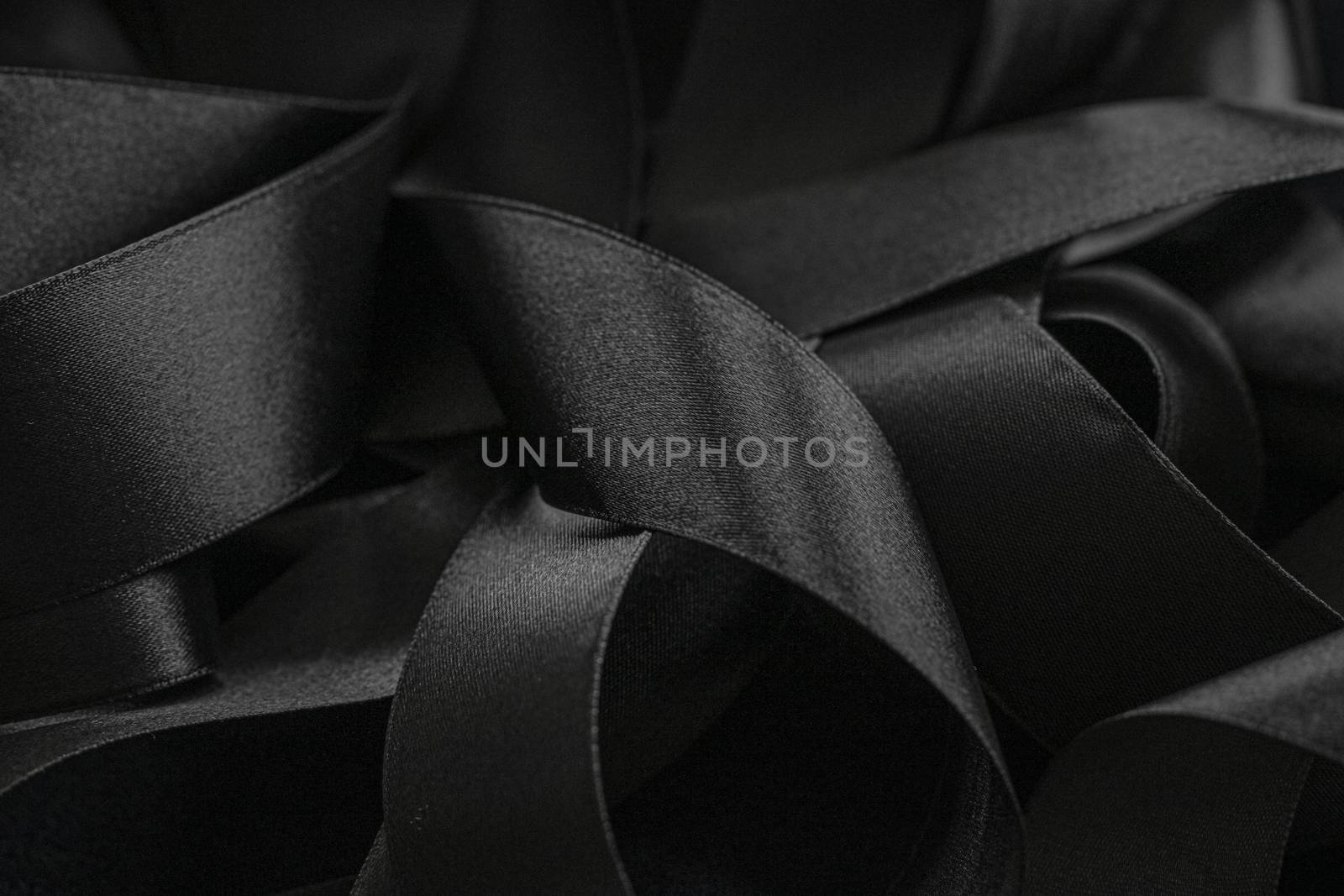 Black silk ribbon as background, abstract and luxury brand design by Anneleven