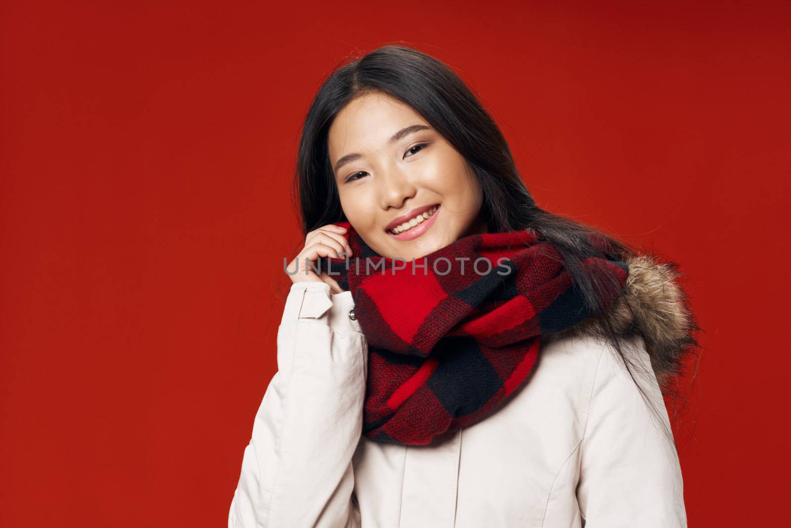 A beautiful woman with an Asian appearance is smiling at the camera by SHOTPRIME