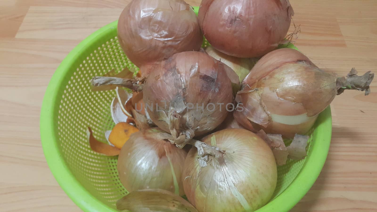 Closeup view of onions pile in supermarket. It is full of vitamins, minerals and antioxidants. Vegetable background