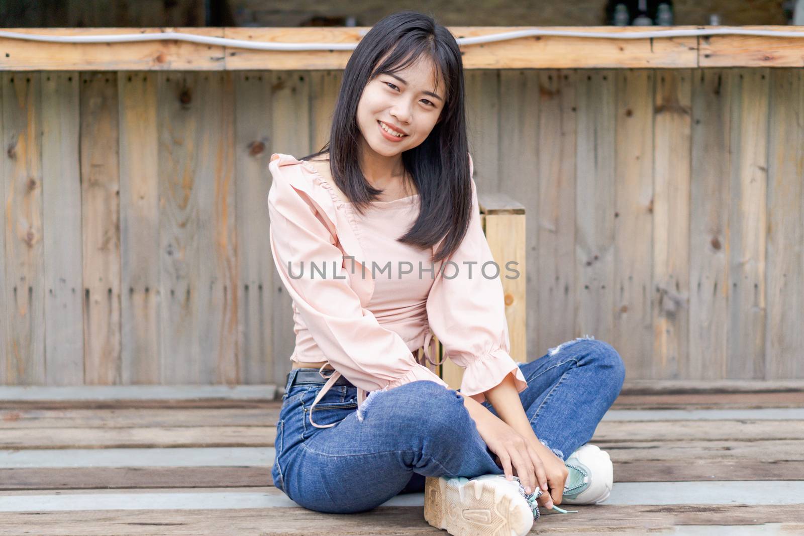 Portrait of asian happy woman smiling with wooden bridge, Select by pt.pongsak@gmail.com