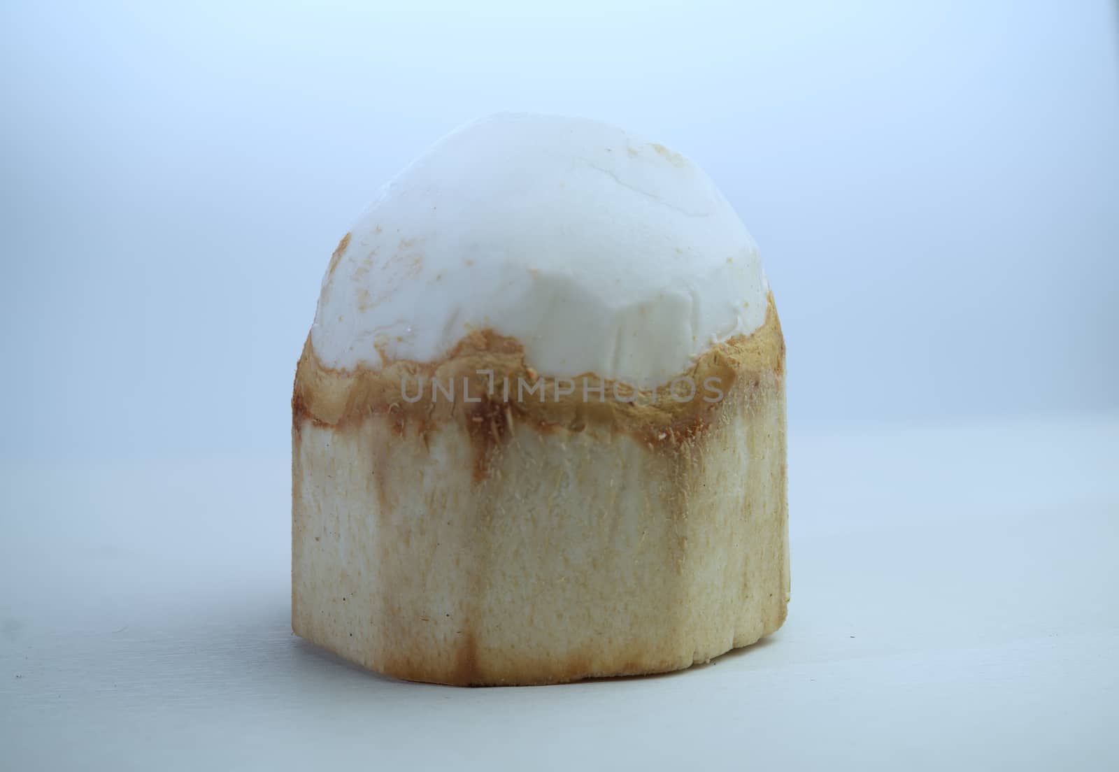 Young coconut fruit is peeled off and ready to eat and is made into a combination of savory and sweet food on a white background.