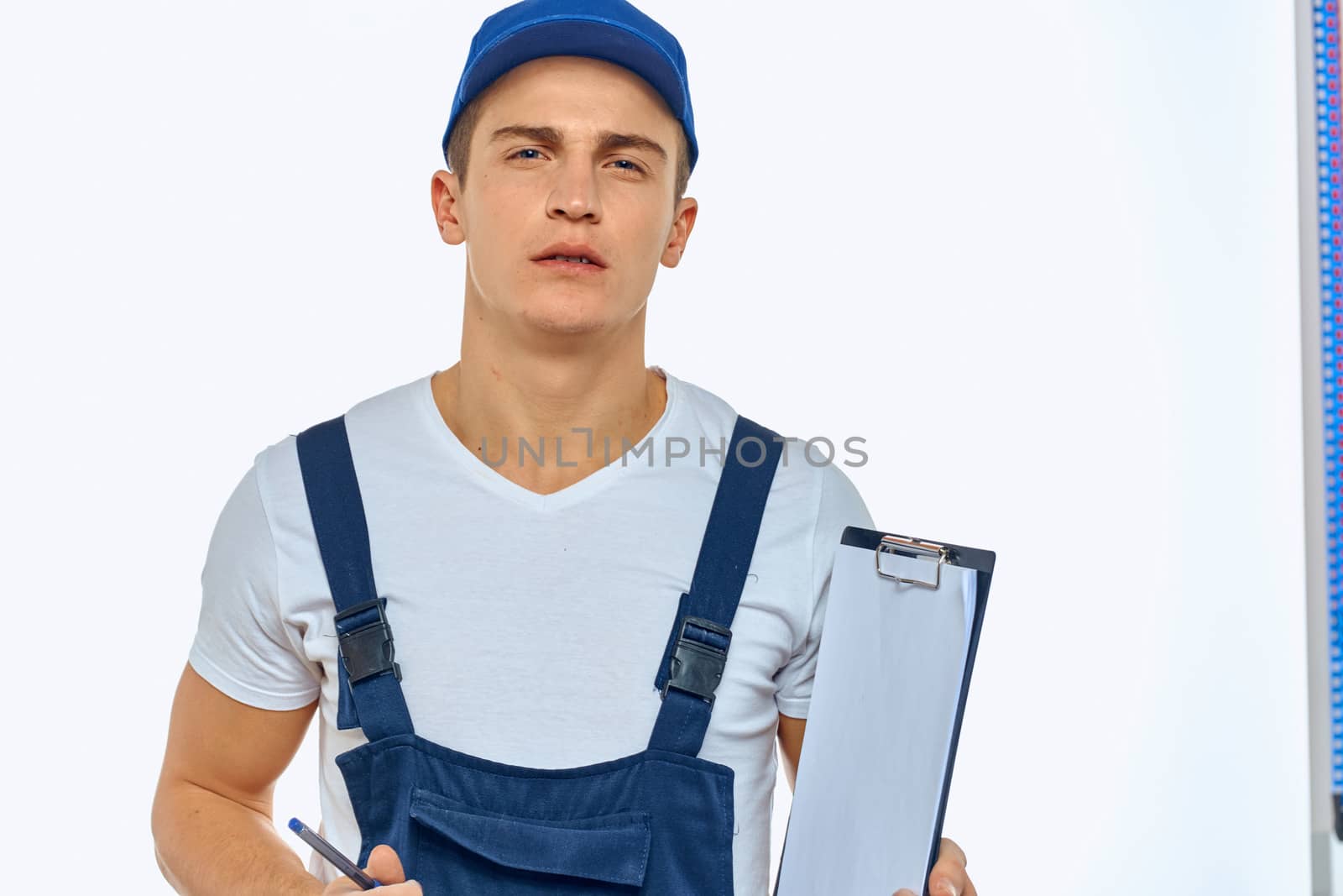 Working man in uniform documents delivery service courier. High quality photo