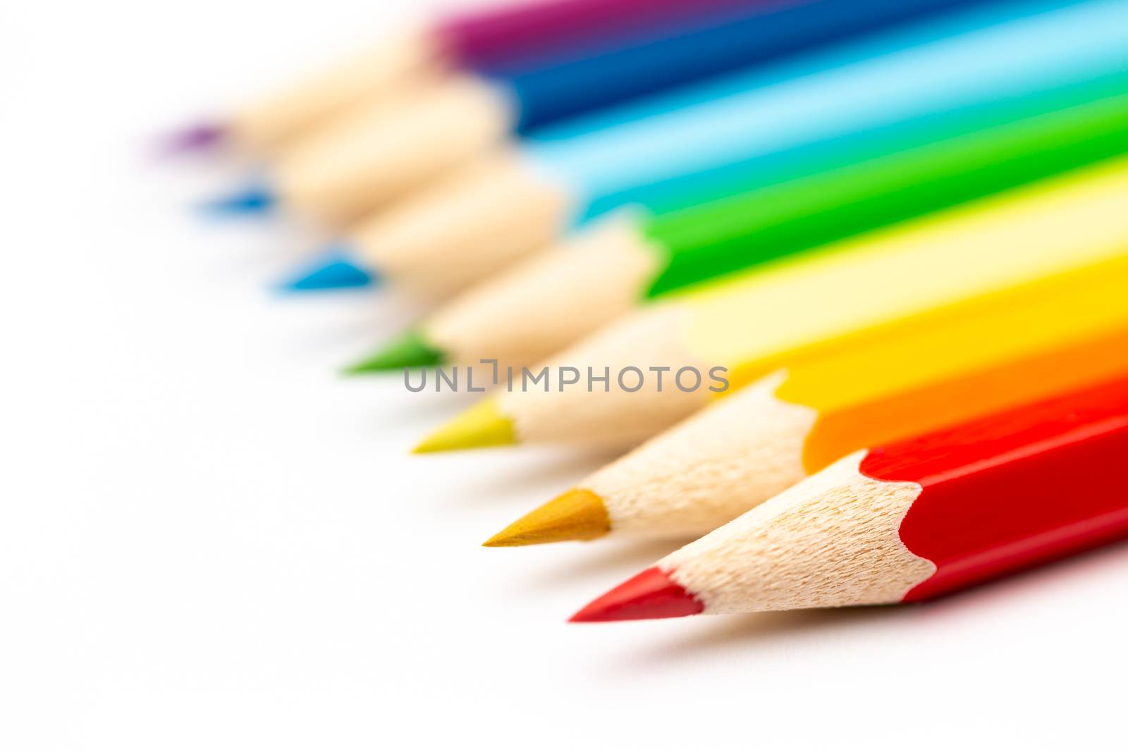 A Colorful color wooden pencils on a white background