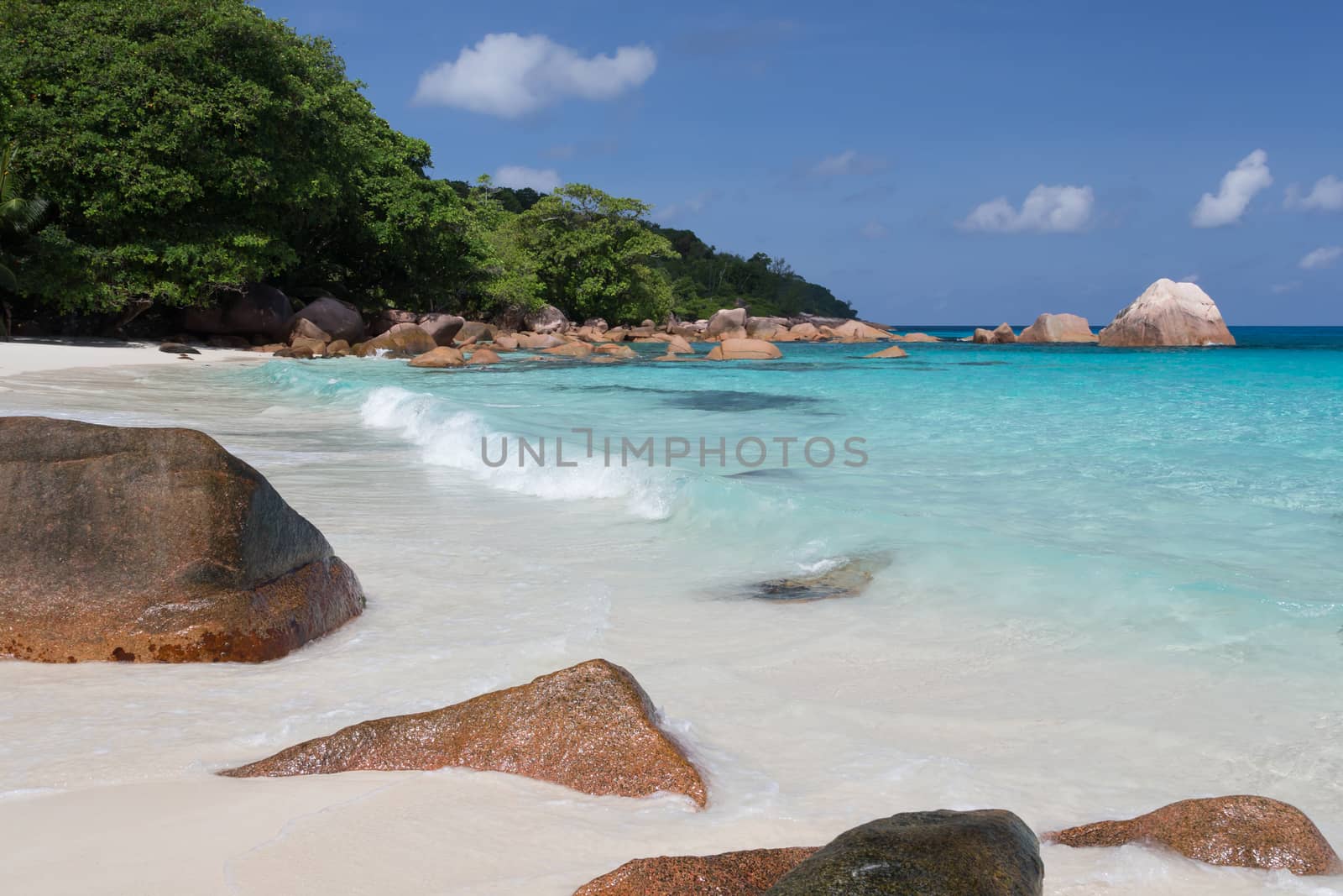 Seychelles with a turqouise water and big stones and lot of gree by 25ehaag6