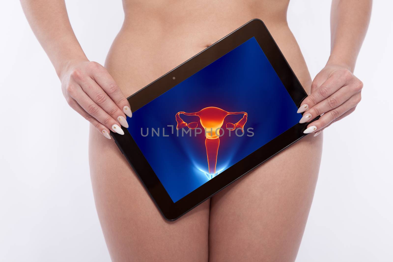 Woman with a tablet screening the reproductive organs by 25ehaag6