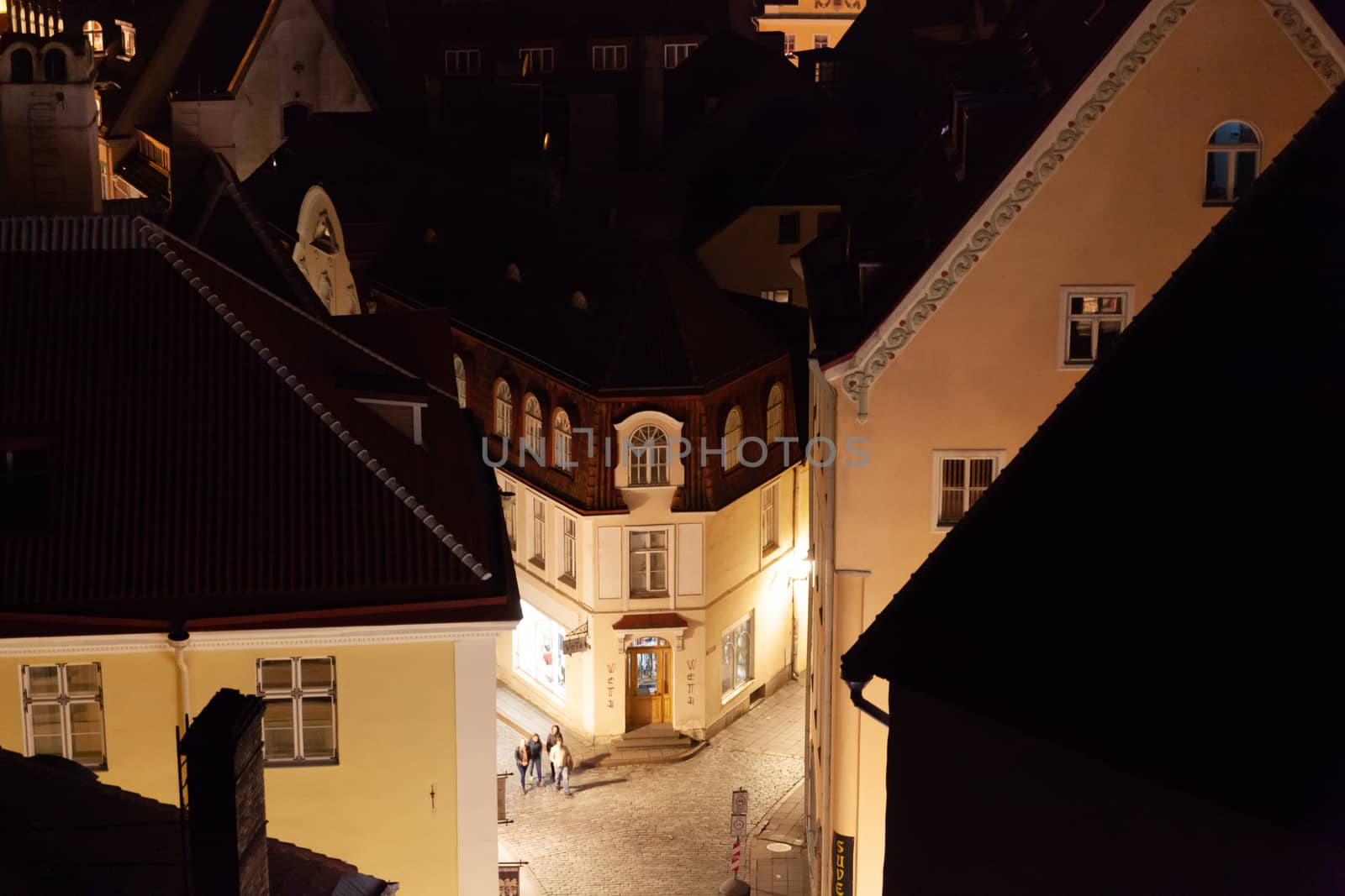 Tallinn, Estonia - October 2018: Old town view from Kohtuotsa to the corner of Pikk and Voorimehe streets at night