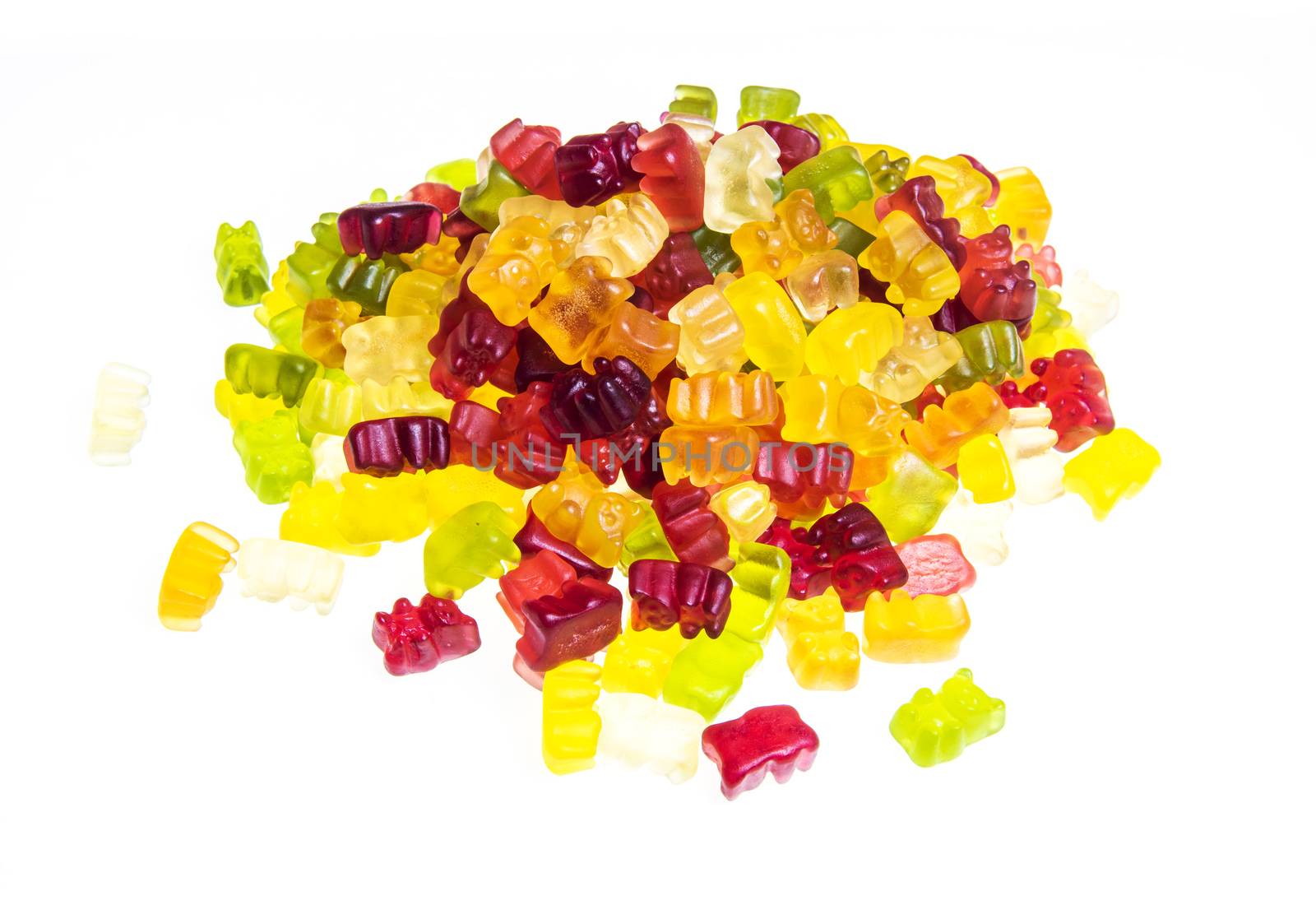 Heap of various multicolored gummy bears candies isolated on a white background