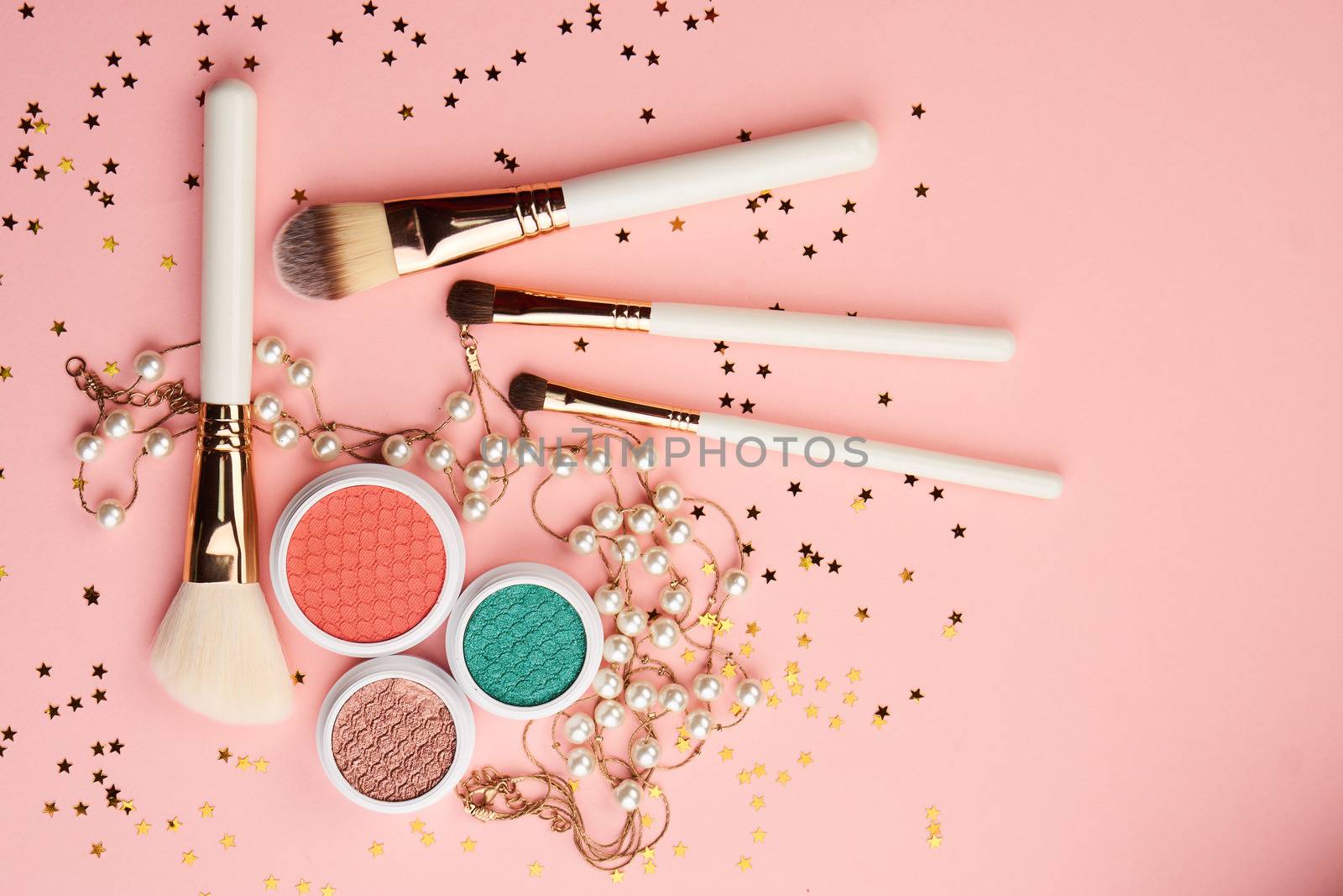 cosmetic accessories eyeshadow accessories makeup brushes merchandise collection professional cosmetics on pink background.