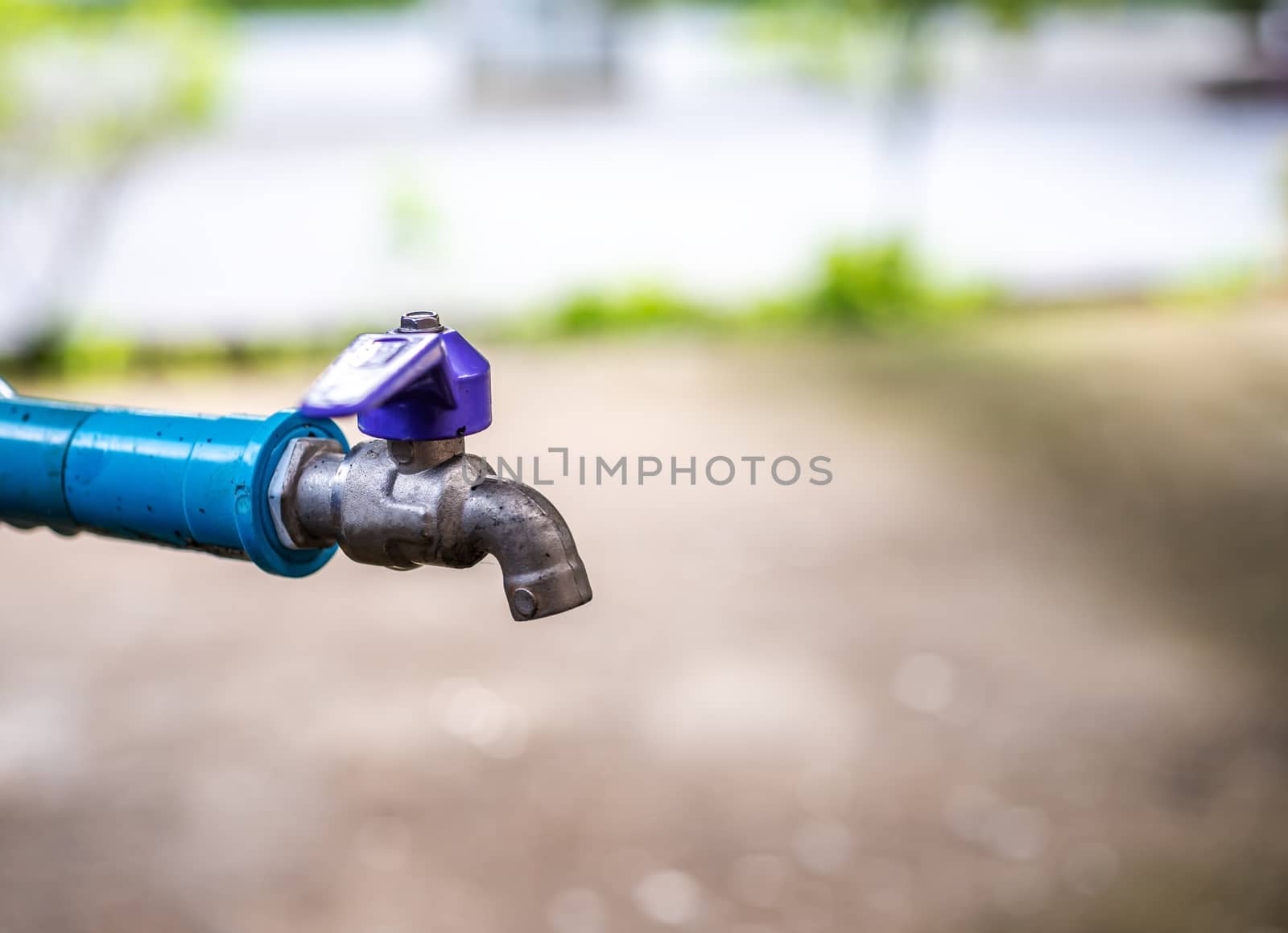 Old water tap blurred background, Save water cocept, Save world and save life concept