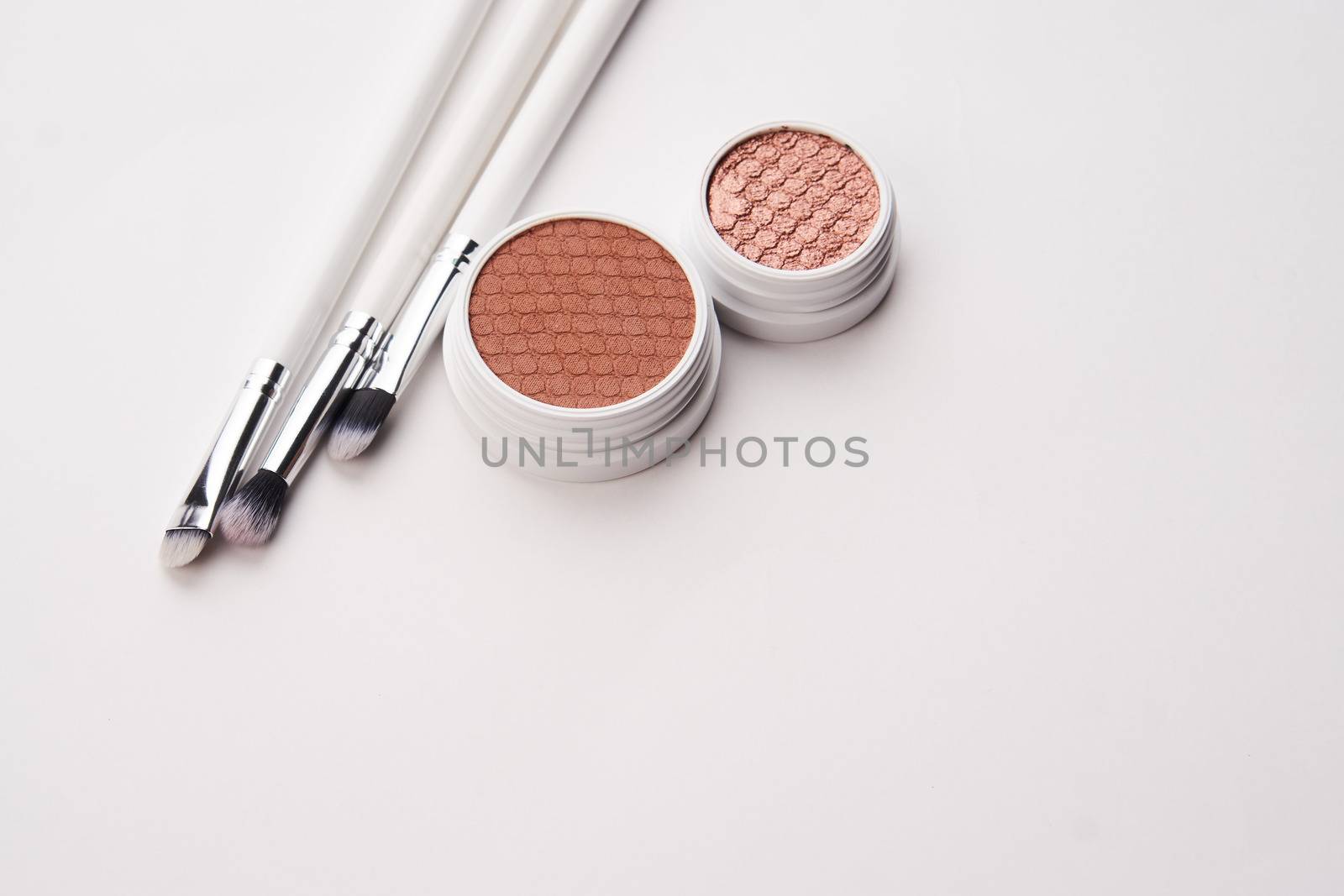 professional eyeshadow on isolated background and makeup brushes cosmetics fashion by SHOTPRIME