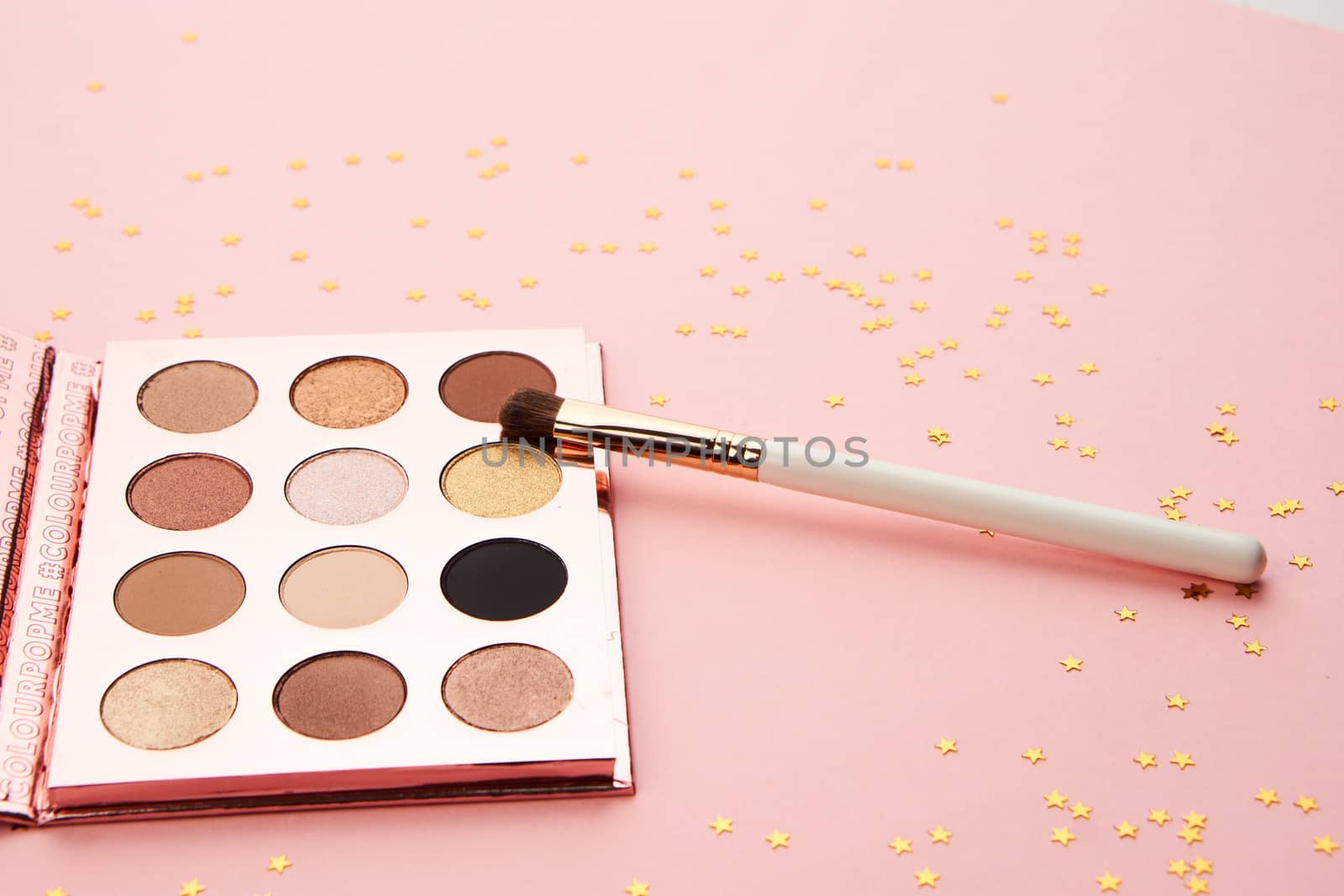 eyeshadow makeup brushes collection professional cosmetics accessories on pink background. High quality photo