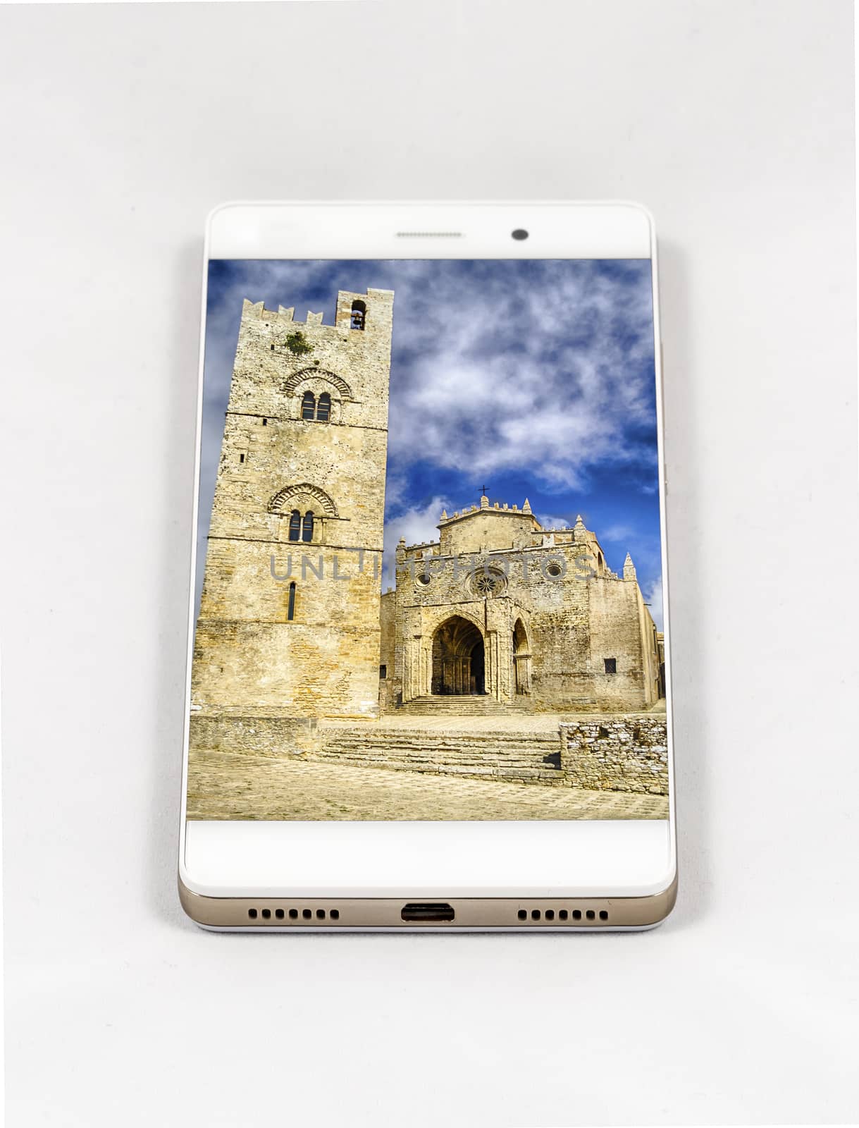 Modern smartphone with full screen picture of Erice Cathedral, Italy. Concept for travel smartphone photography. All images in this composition are made by me and separately available on my portfolio
